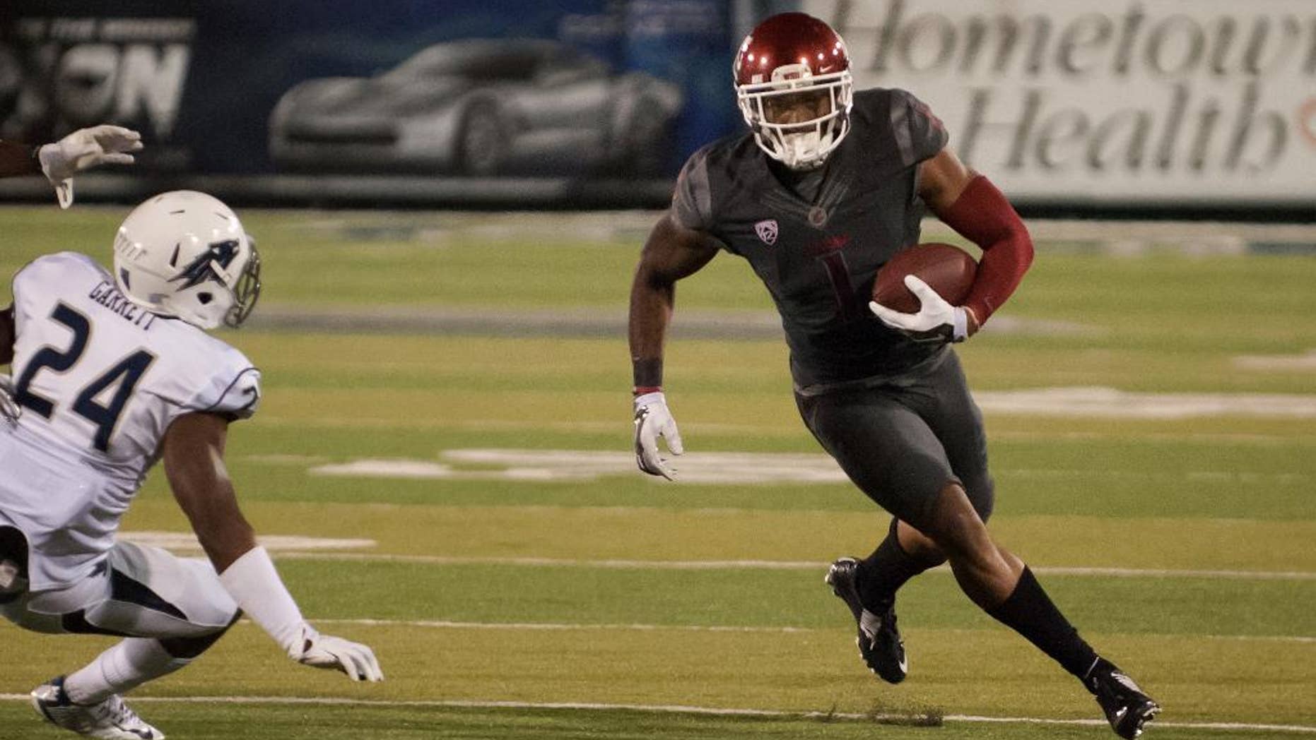 Washington State's Vince Mayle (1) turns the corner against Nevada's Charles Garrett (24) in the first half of an NCAA college football game on Friday, Sept. 5, 2014 in Reno, Nev. (AP Photo/Kevin Clifford)