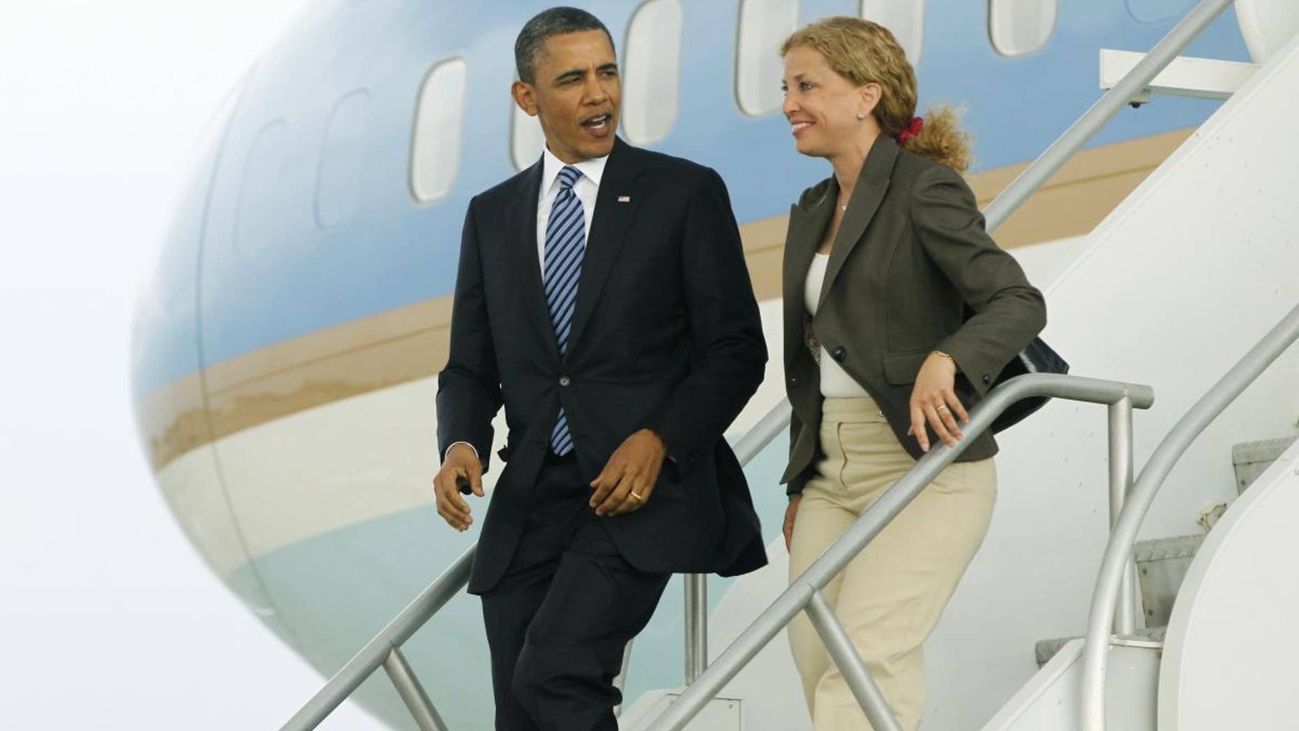 President Barack Obama and Democratic National Committee Chair, Rep. Debbie Wasserman Schultz, D-Fla. step off Air Force One in Miami, Friday, April 29, 2011. (AP Photo/Charles Dharapak)