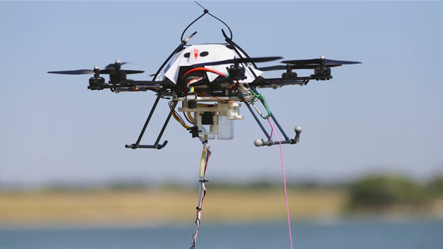 FILE: A water collecting drone hovers at a testing site in Lincoln, Neb.