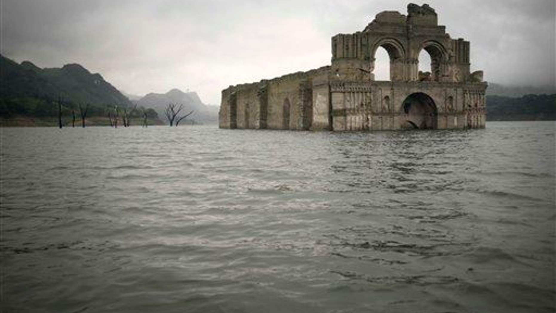 The remains of a mid-16th century church known as the Temple of Santiago is visible from the surface of the Grijalva River, near the town of Nueva Quechula, in Chiapas state, Mexico, Oct. 16, 2015.