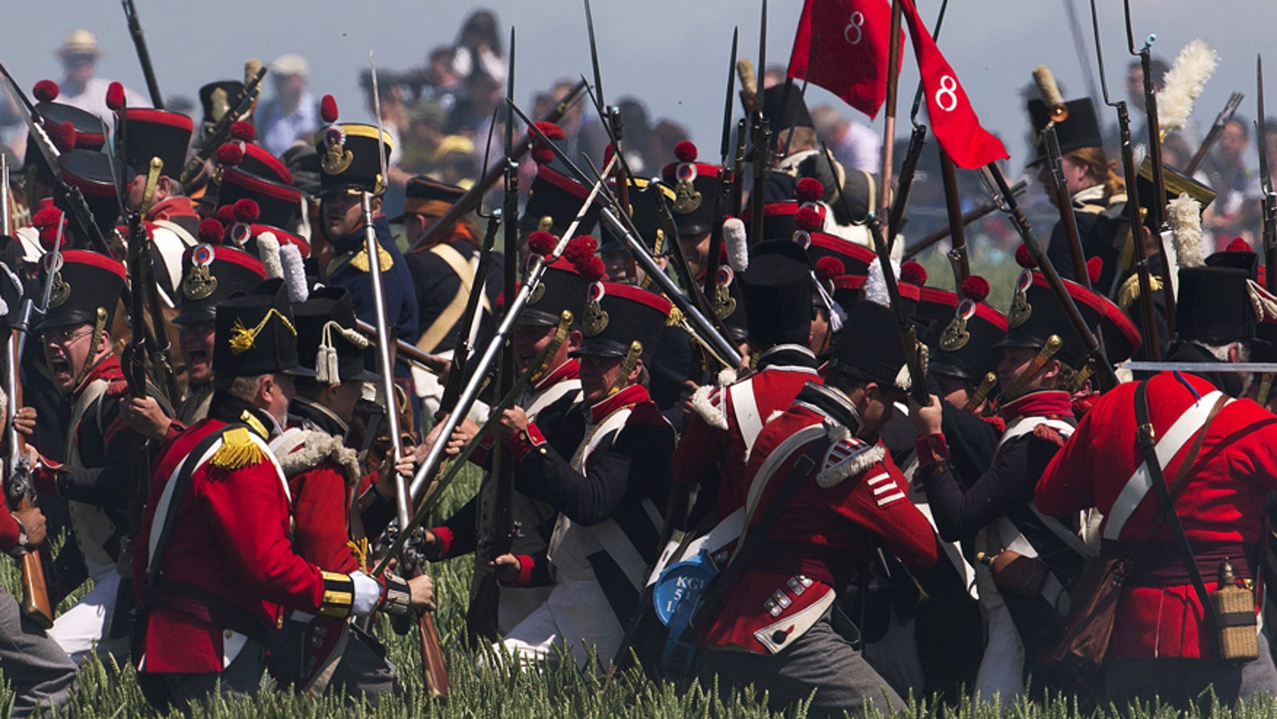 Performers take part in the re-enactment of the battle of Ligny, during the bicentennial celebrations for the Battle of Waterloo, in Ligny, Belgium, June 14, 2015.