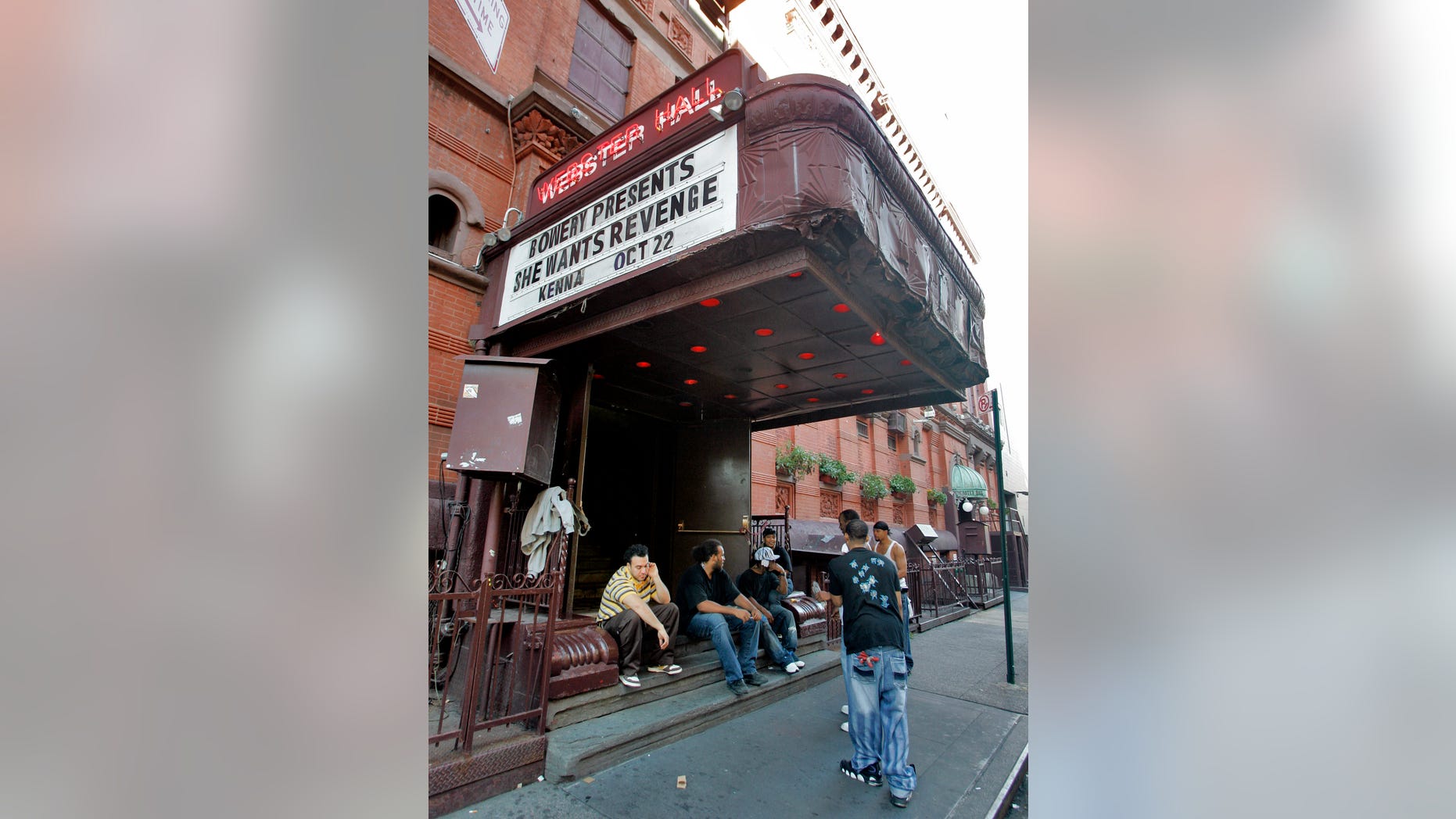 Oct. 22, 2007: In this file photo, workers at New York's Webster Hall take a break under the marquee.