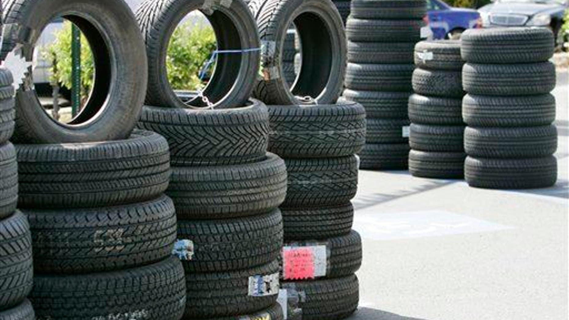 Tires are displayed outside of a Goodyear Tires shop in San Jose.