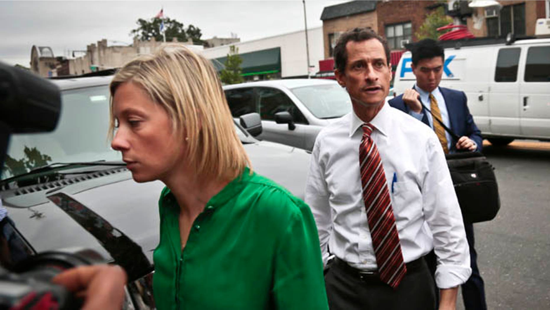 July 25: Anthony Weiner arrives with chief spokeswoman Barbara Morgan, left, who has been criticized after an interview she said she believed was off the record.