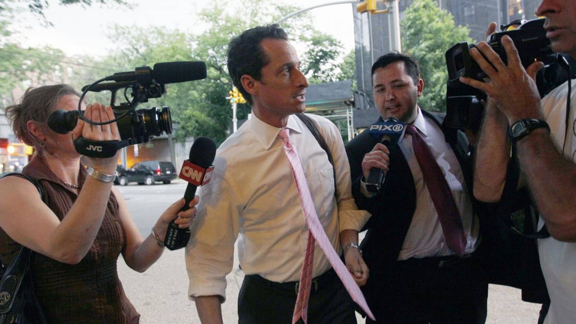 Rep. Anthony Weiner is surrounded by reporters as he arrives at his house in the Queens borough of New York June 9. (AP)