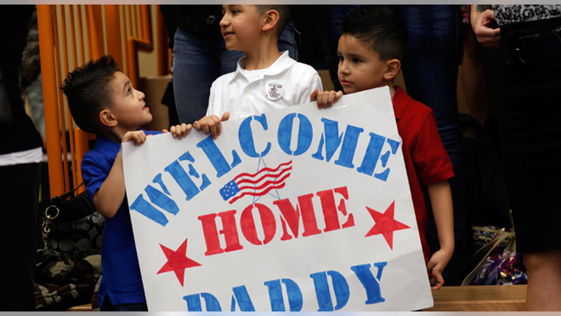 Family members wait for their loved ones of the 170th U.S. Army Infantry Brigade upon the troops' return from Afghanistan at U.S. Army Garrison Baumholder on January 28, 2012 in Baumholder, Germany. (Photo by Ralph Orlowski/Getty Images)