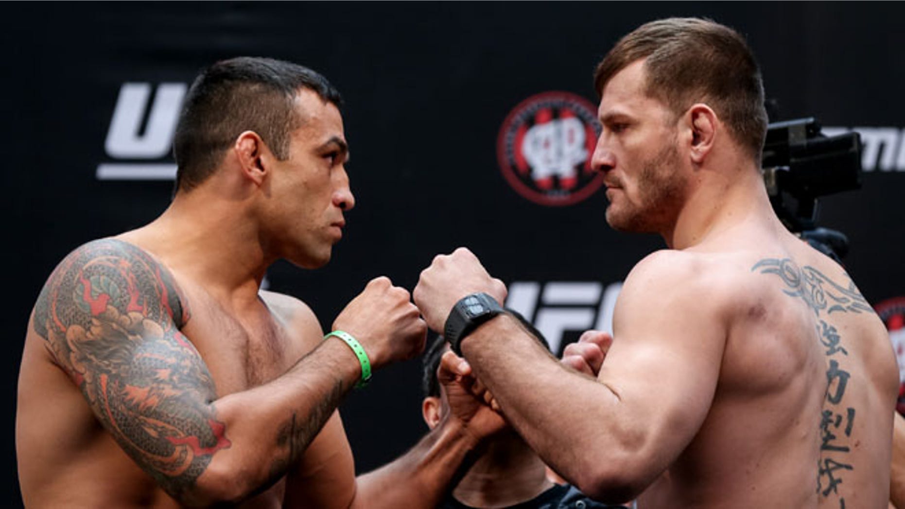 CURITIBA, BRAZIL - MAY 13: (L-R) Opponents Fabricio Werdum of Brazil and Stipe Miocic of the United States face off during the UFC 198 weigh-in at Arena da Baixada stadium on May 13, 2016 in Curitiba, Brazil. (Photo by Buda Mendes/Getty Images)