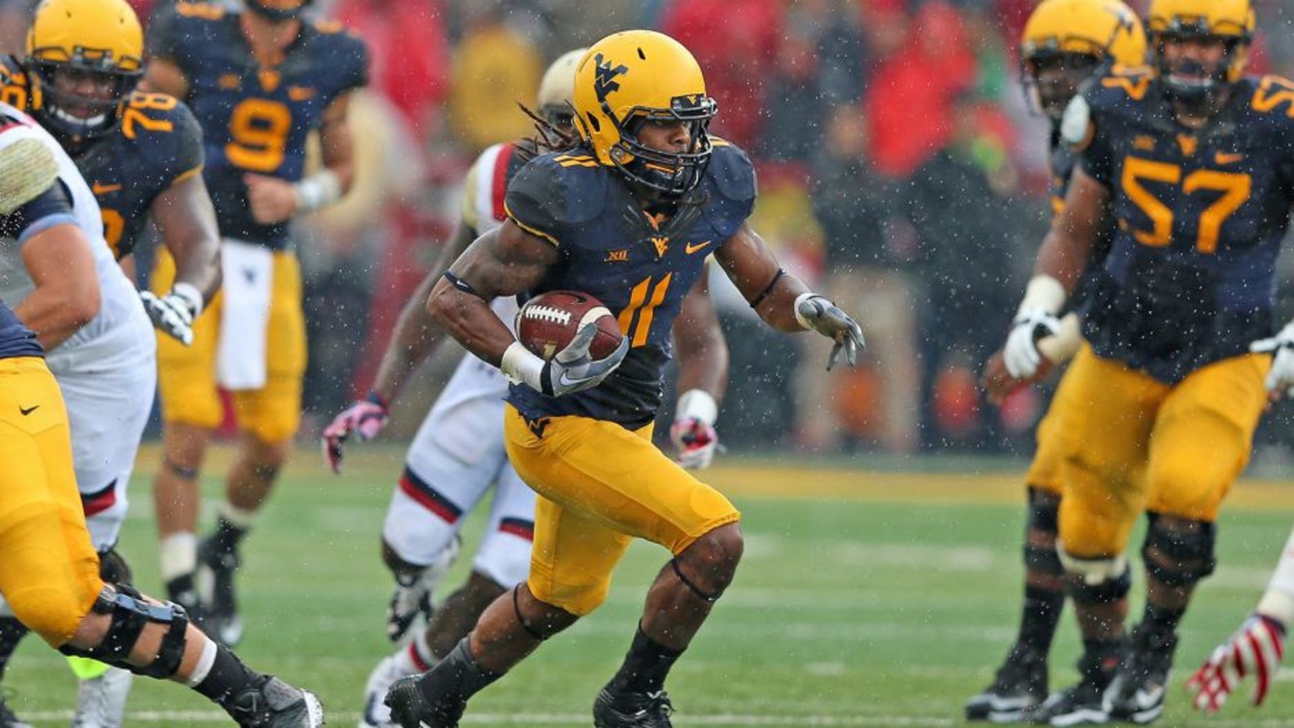 Sep 13, 2014; College Park, MD, USA; West Virginia Mountaineers wide receiver Kevin White (11) gains yards after his catch against the Maryland Terrapins at Byrd Stadium. Mandatory Credit: Mitch Stringer-USA TODAY Sports