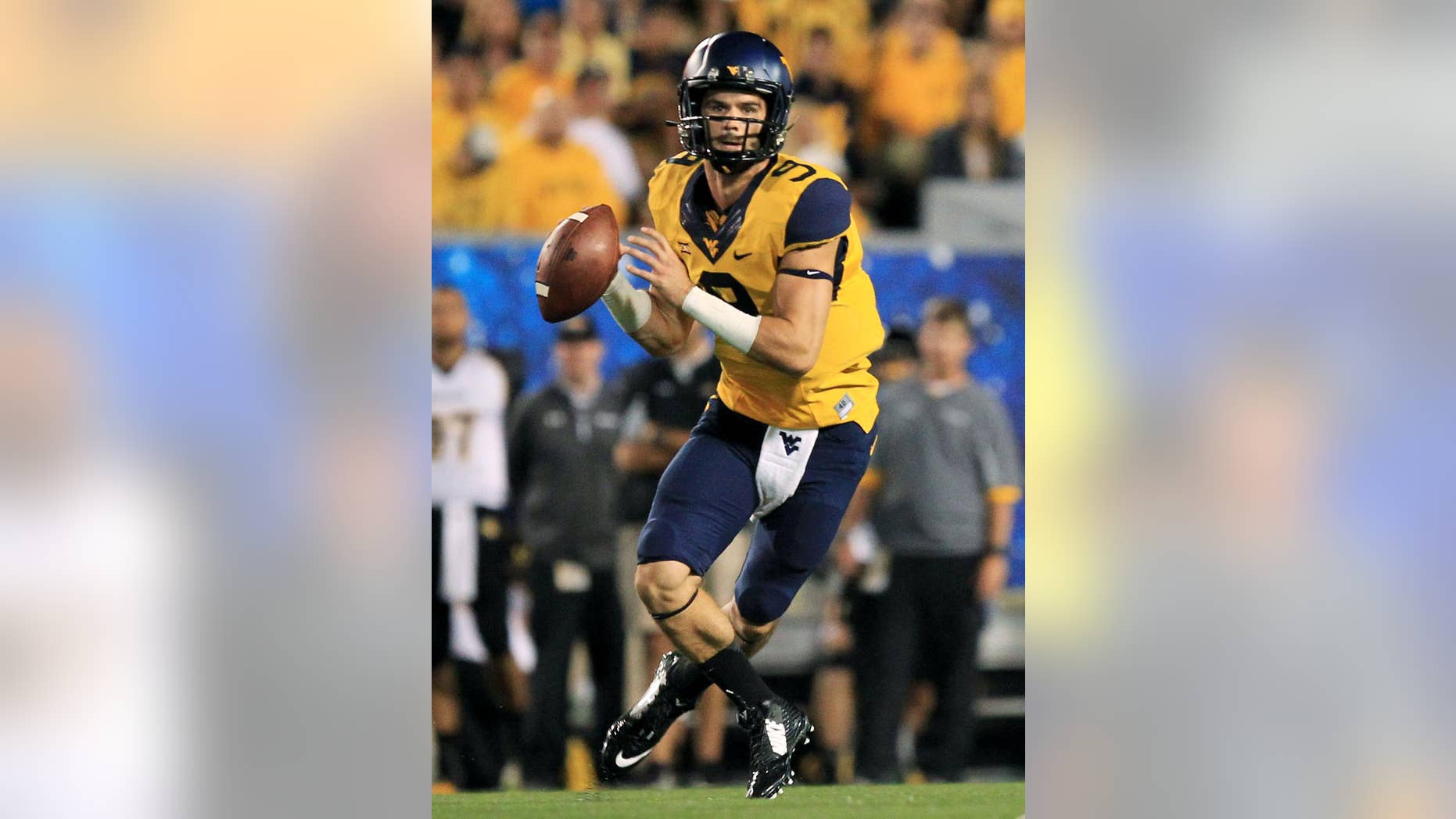 FILE - In this Sept. 6, 2014, file photo, West Virginia quarterback Clint Trickett (9) rolls out of the pocket looking for a receiver during the second quarter of an NCAA college football game against Towson in Morgantown, W.Va. A year after he watched from the sideline still learning the system as the Mountaineers struggled against the Sooners, Trickett is on a roll and will lead West Virginia into a showdown with No. 4 Oklahoma on Saturday night (AP Photo/Chris Jackson, File)