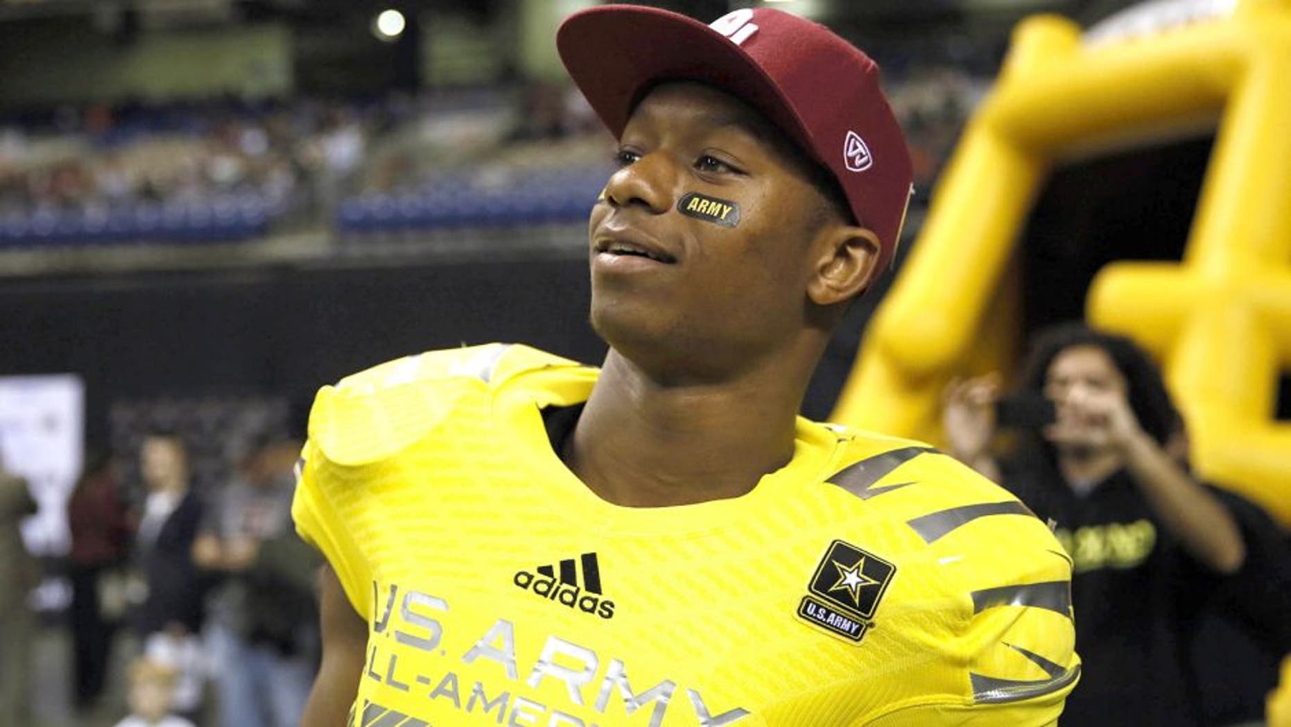 Jan 4, 2014; San Antonio, TX, USA; West running back Joe Mixon (28) watches from the sidelines during U.S. Army All-American Bowl high school football game at the Alamodome. The West won 28-6. Mandatory Credit: Soobum Im-USA TODAY Sports