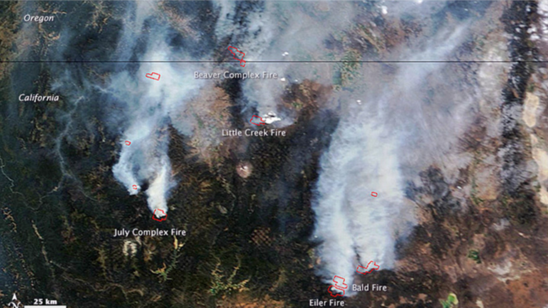 August 2, 2014: This satellite image provided by NASA shows a view from space of several fires burning in northern California and southern Oregon. The Moderate Resolution Imaging Spectroradiometer (MODIS) on NASAs Terra satellite captured the image. Red outlines show where high surface temperatures are associated with active burning. (AP Photo/NASA)