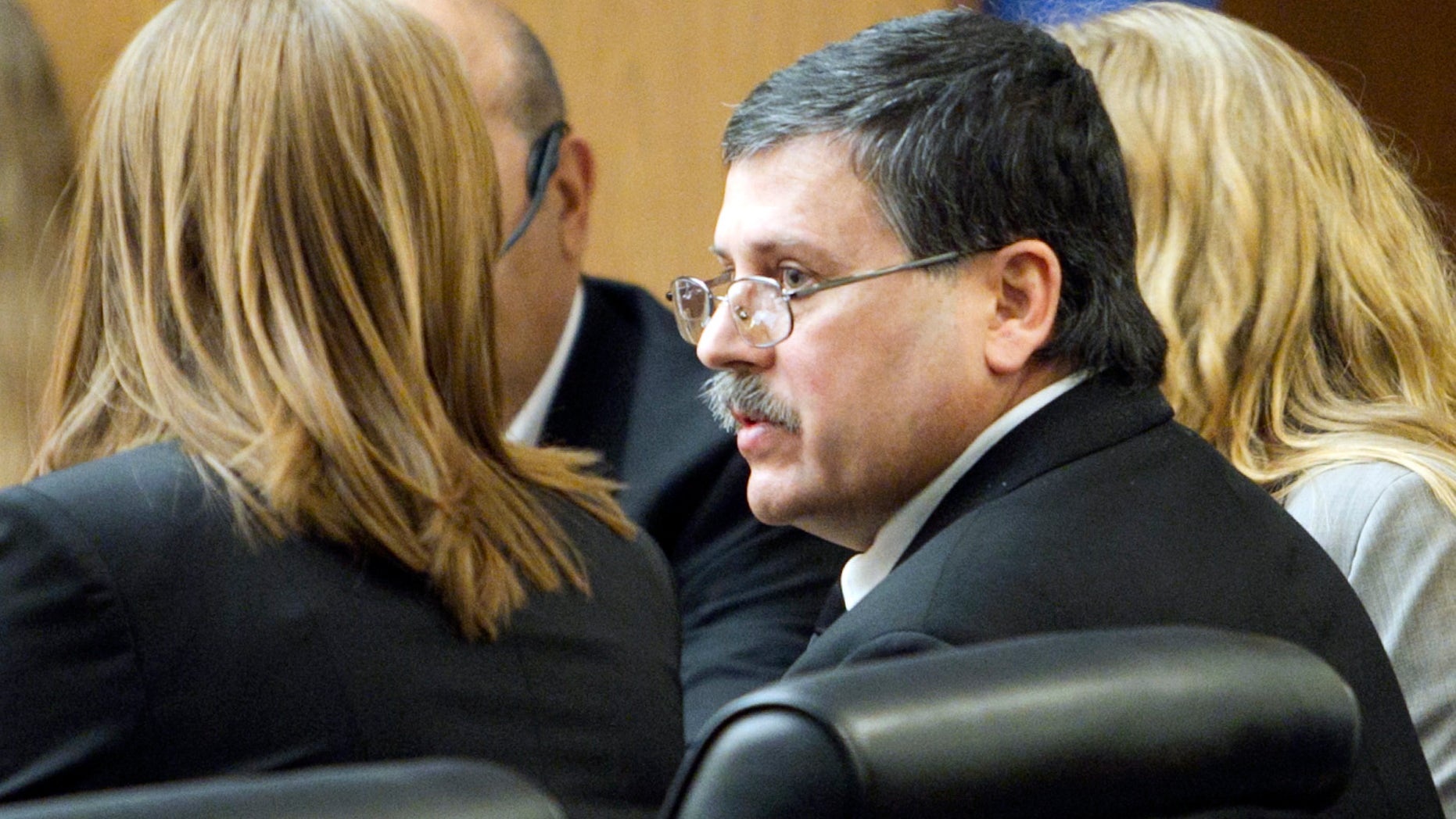 Feb. 22: Faleh Hassan Almaleki sits with an attorney during his trial in Phoenix. A jury convicted Almaleki, a 50-year-old Iraqi immigrant, of second-degree murder for running over and killing his daughter in a case prosecutors called an "honor killing."