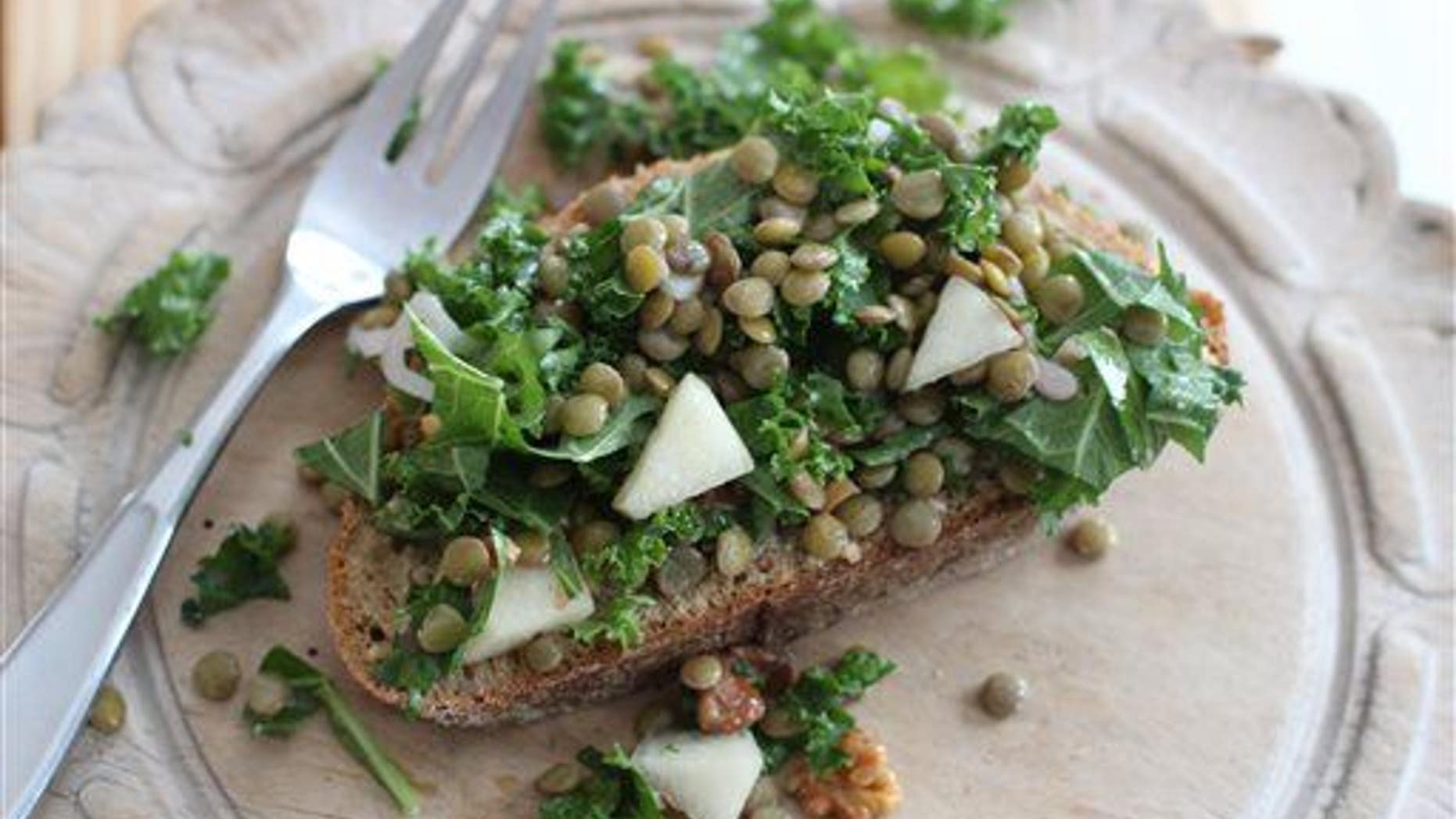 This Feb. 2, 2015, photo shows chopped kale and lentil winter salad.