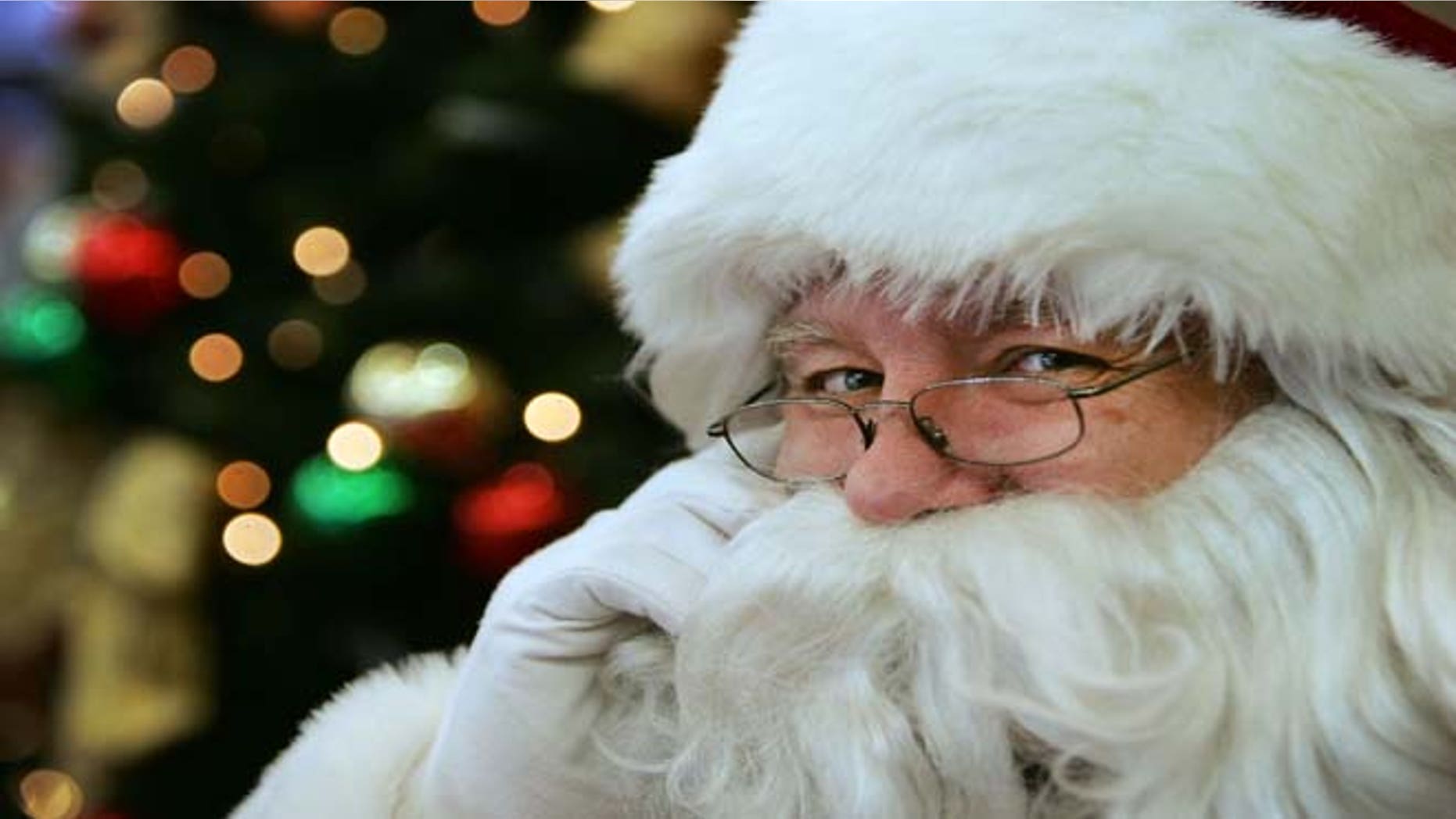 Volunteers take phone calls from children asking where Santa is and when he will deliver presents to their house, during the annual NORAD Tracks Santa Operation.