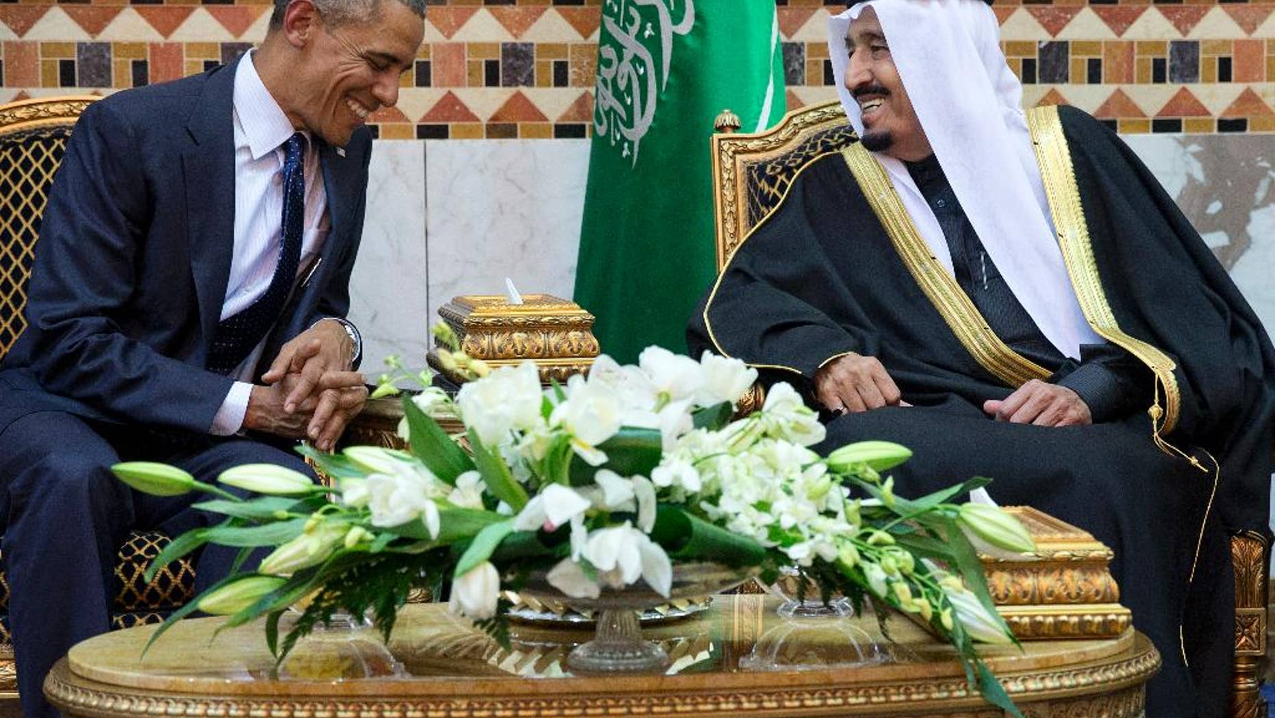 FILE - In this Jan. 27, 2015 file photo, President Barack Obama meets Saudi Arabian King Salman in Riyadh, Saudi Arabia. The Obama administration is greeting King Salman of Saudi Arabia with assurances that a nuclear deal with Iran also comes with the necessary resources to help check its regional ambitions. (AP Photo/Carolyn Kaster, File)