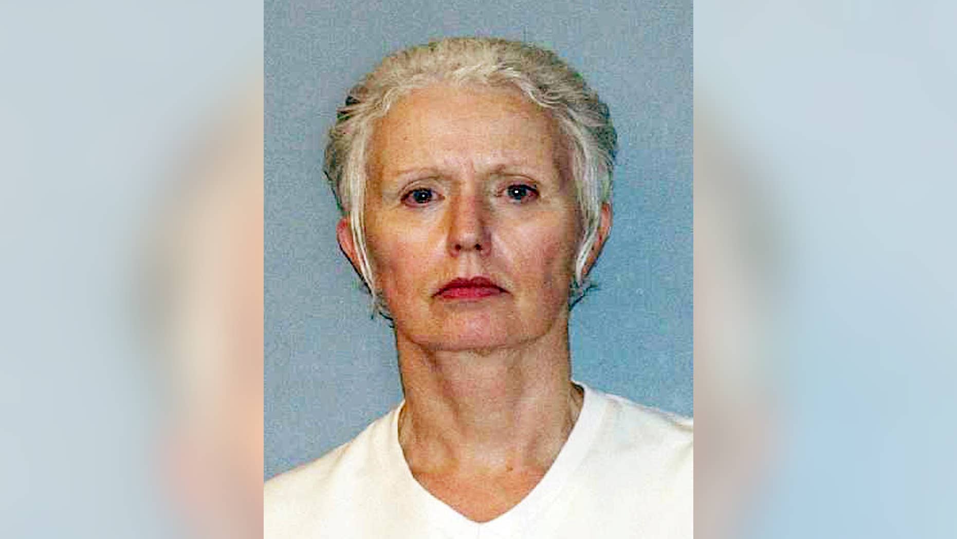 FILE - This undated file photo provided by the U.S. Marshals Service shows Catherine Greig, longtime girlfriend of Whitey Bulger, who was captured with Bulger in 2011 in Santa Monica, Calif. Greig pleaded guilty in federal court in Boston in 2012 and is serving an eight-year sentence for identity fraud and conspiracy to harbor a fugitive. Greig was indicted Tuesday, Sept. 22, 2015, on one count of criminal contempt that alleges she refused to testify since December 2014 whether other people helped Bulger during his 16 years on the run. (AP Photo/U.S. Marshals Service, File)