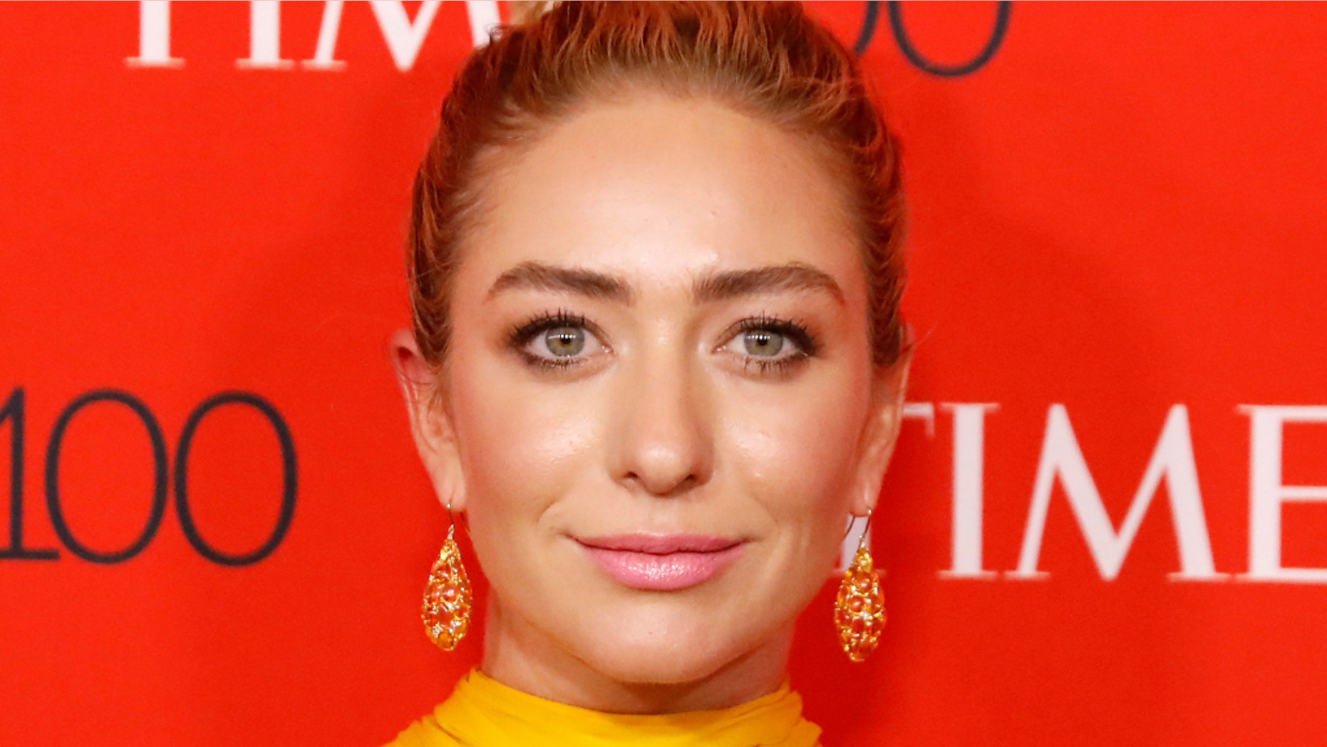 Bumble CEO Whitney Wolfe Herd has her photo taken on the red carpet after arriving for the TIME 100 Gala in Manhattan, New York, U.S., April 24, 2018. REUTERS/Shannon Stapleton - RC1C8E20D780