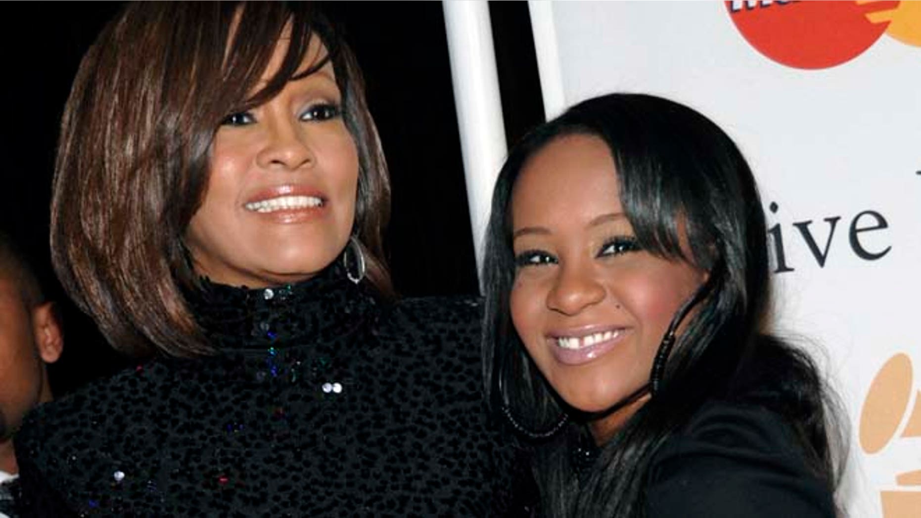 Feb. 12, 2011: In this file photo, singer Whitney Houston, left, and daughter Bobbi Kristina Brown arrive at an event in Beverly Hills, Calif. (AP)