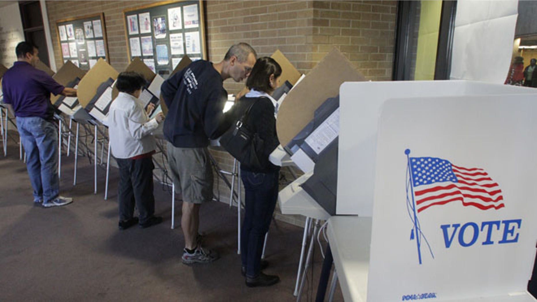 Oct. 30, 2012: People vote early at the Salt Lake County Government Building in Salt Lake City.