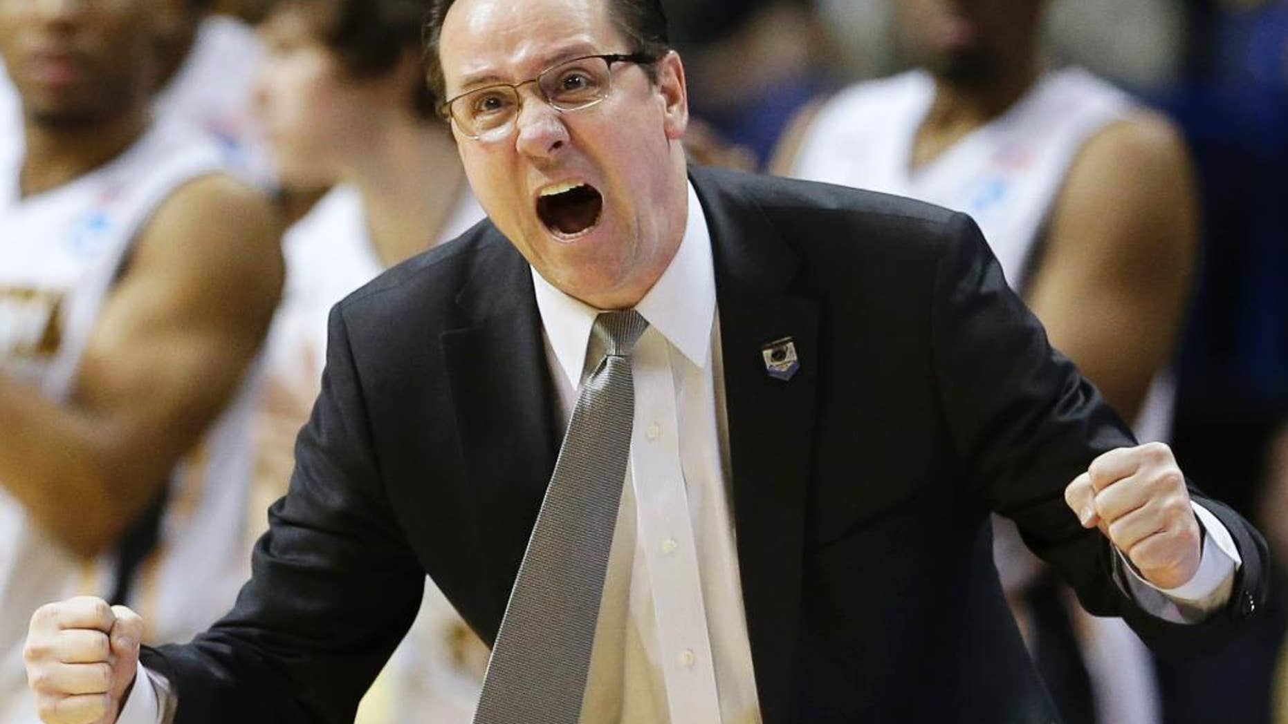 FILE - In this March 23, 2014 file photo, Wichita State head coach Gregg Marshall encourages his team during the second half of a third-round game against Kentucky at the NCAA college basketball tournament in St. Louis. After a perfect regular season ended with an ouster at the hands of Kentucky as a No. 1 seed in the NCAA tournament, No. 11 Wichita State is ready to begin pursuit of another Final Four. (AP Photo/Charlie Riedel, File)