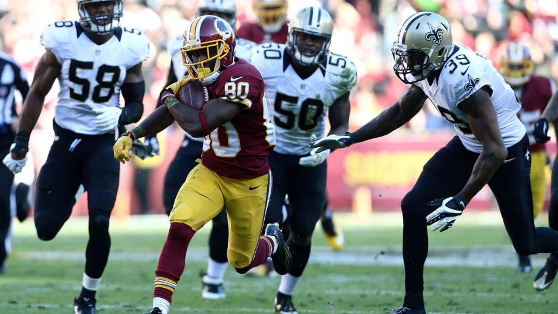 LANDOVER, MD - NOVEMBER 15: Wide receiver Jamison Crowder #80 of the Washington Redskins carries the ball past cornerback Brandon Browner #39 of the New Orleans Saints, middle linebacker Stephone Anthony #50 of the New Orleans Saints, linebacker James Anderson #58 of the New Orleans Saints in the second quarter of a game at FedExField on November 15, 2015 in Landover, Maryland. (Photo by Matt Hazlett/Getty Images)