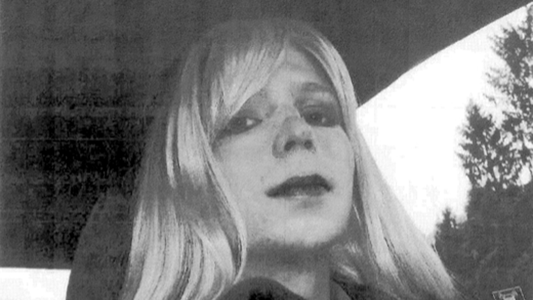 FILE - In this undated file photo provided by the U.S. Army, Pfc. Chelsea Manning poses for a photo wearing a wig and lipstick. In an unprecedented move, the Pentagon is trying to transfer convicted national security leaker Pvt. Chelsea Manning to a civilian prison so she can get treatment for her gender disorder, defense officials said Tuesday May 13, 2014. (AP Photo/U.S. Army, File)