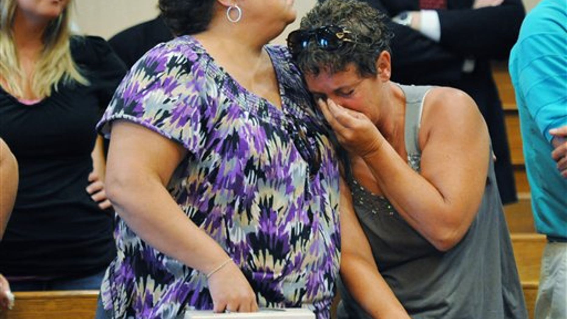 August 12: Family members and friends of the slain Liske family react in Ottawa County Common Pleas Court as William Liske is lead out of the courtroom in Port Clinton, Ohio.