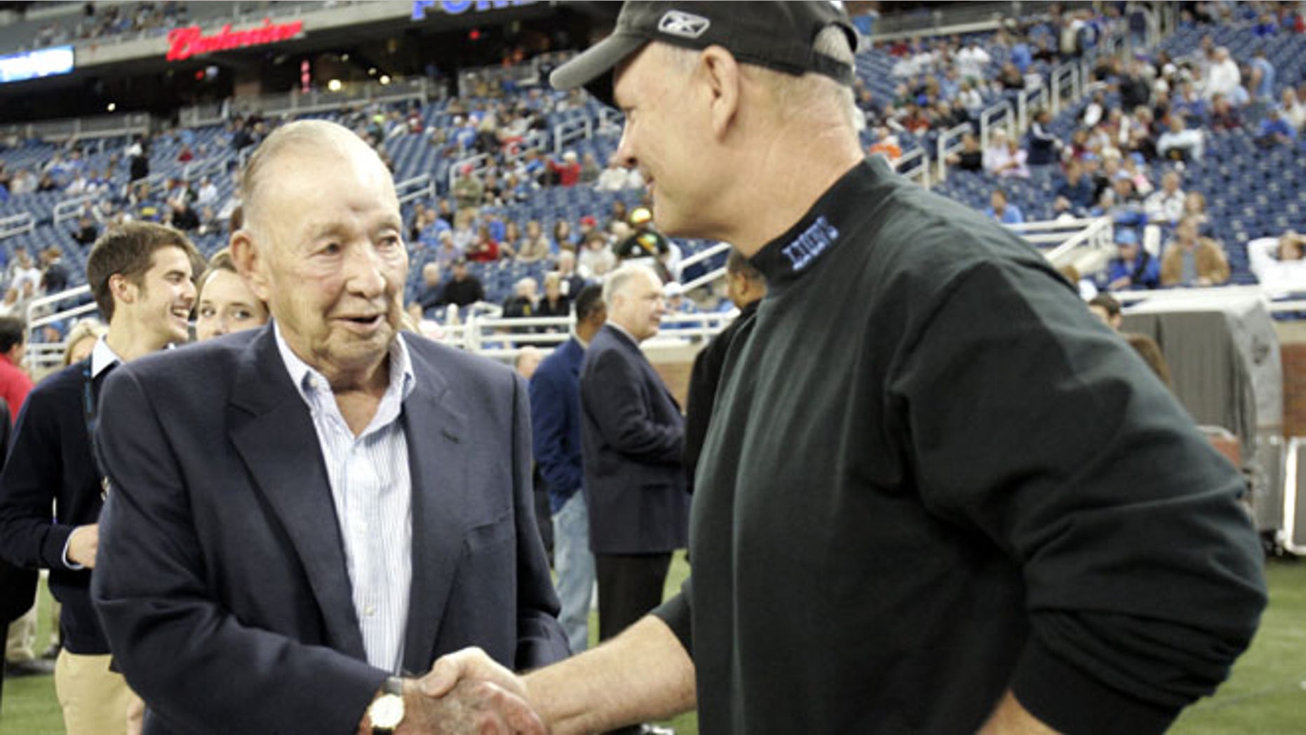 Detroit Lions team owner William Clay Ford Sr. (L) shakes hands with Lions head coach Rod Marinelli before the start of their NFL football game against the New York Giants in Detroit, Michgan November 18, 2007. REUTERS/Rebecca Cook (UNITED STATES) - RTX33KD
