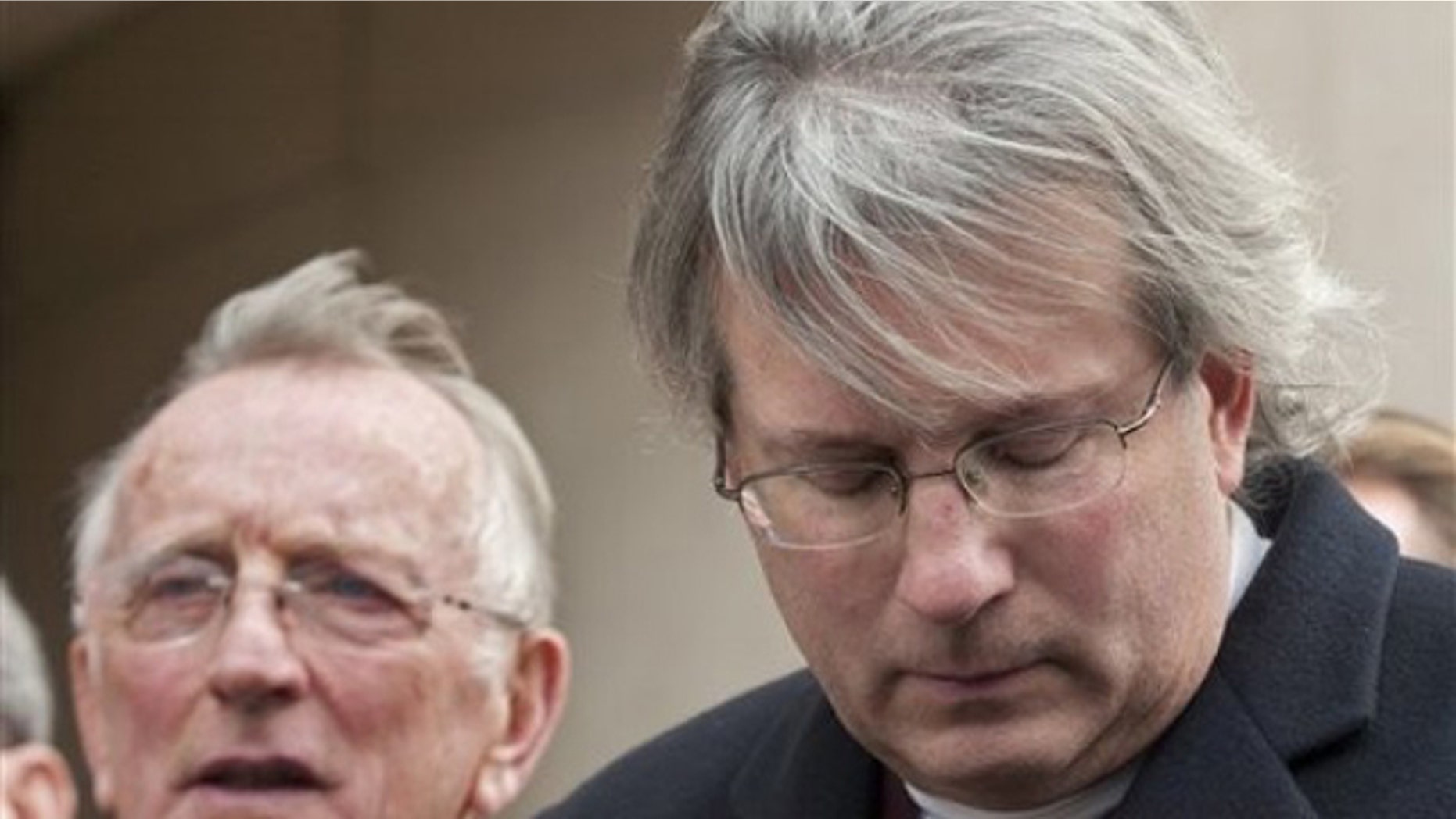 Nov. 8: Dr. William A. Petit Jr. , right, and his father William Petit, left, react to the sentence given to Steven Hayes following jury deliberations at the New Haven, Conn. , County Courthouse (AP).
