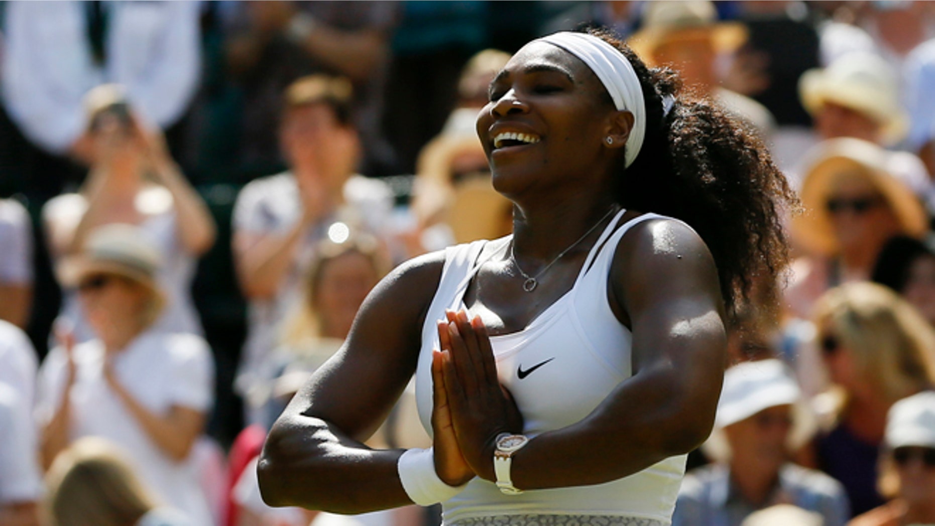 Serena Williams of the United States gestures after winning the singles match Garbine Muguruza of Spain after the women's singles final at the All England Lawn Tennis Championships in Wimbledon, London, Saturday July 11, 2015. Williams won 6-4, 6-4. (AP Photo/Kirsty Wigglesworth)