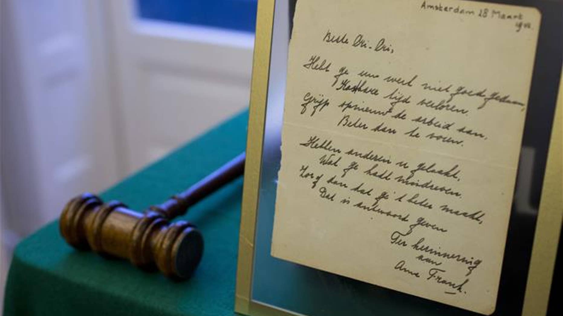 A short poem by Anne Frank is displayed at Bubb Kuyper auction house.