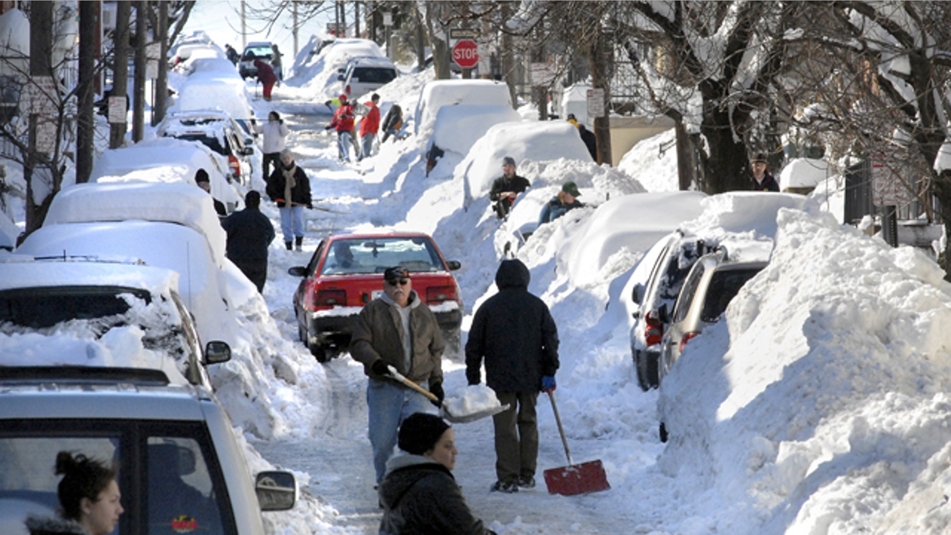 As snow-weary Pennsylvanians dug out, utilities struggled to restore power to thousands and crews worked to reopen closed roads after a record-breaking blizzard that dumped more than a foot of snow across the state.