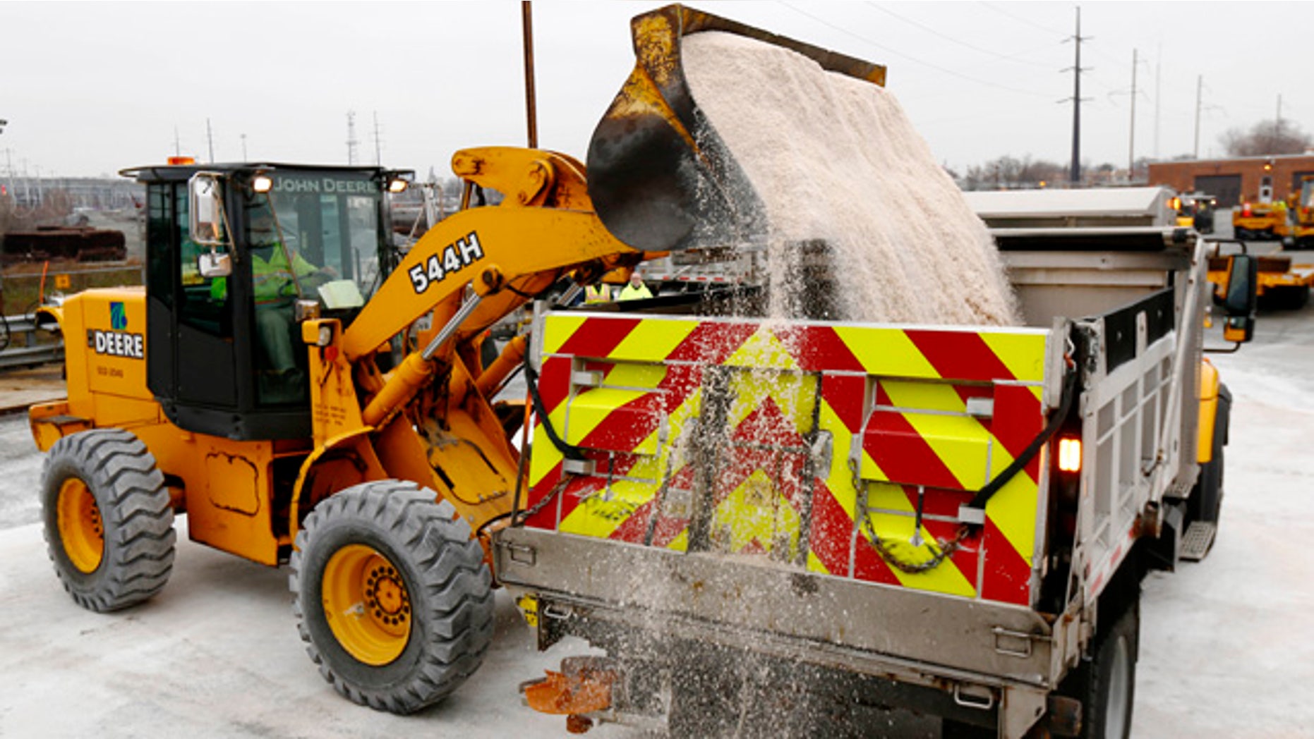 Jan. 2, 2014: A worker at the Pennsylvania Department of Transportation facility dumps salt into a truck as they make preparations for an expected winter storm.