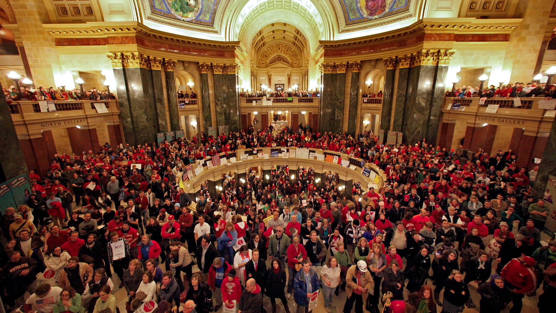 Feb. 16: Protesters to Wisconsin Gov. Scott Walker's proposal to eliminate collective bargaining rights for many state workers gather in the rotunda at the State Capitol in Madison.