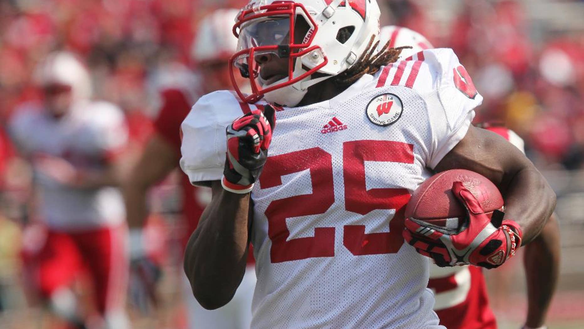 Wisconsin's Melvin Gordon carries the ball in the first half of the NCAA college football team's spring football game Saturday, April 12, 2014, in Madison, Wis. (AP Photo/Wisconsin State Journal, Amber Arnold)