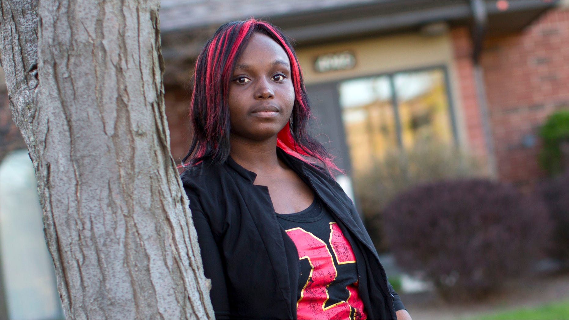 May 7, 2013: Adopted child Quita Puchalla, 21, poses outside her apartment in Milwaukee, Wisconsin.