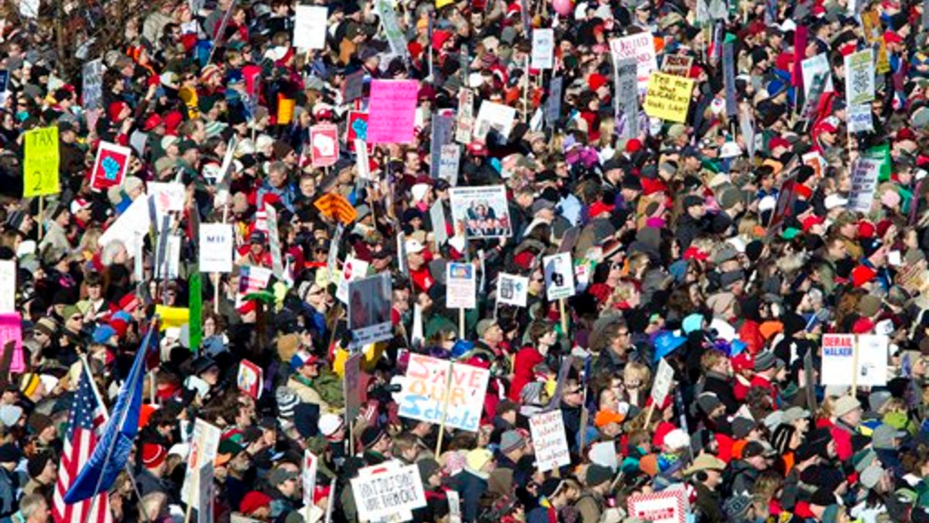 Saturday: Protesters attend a rally with Democratic senators who recently returned to Madison, Wis.