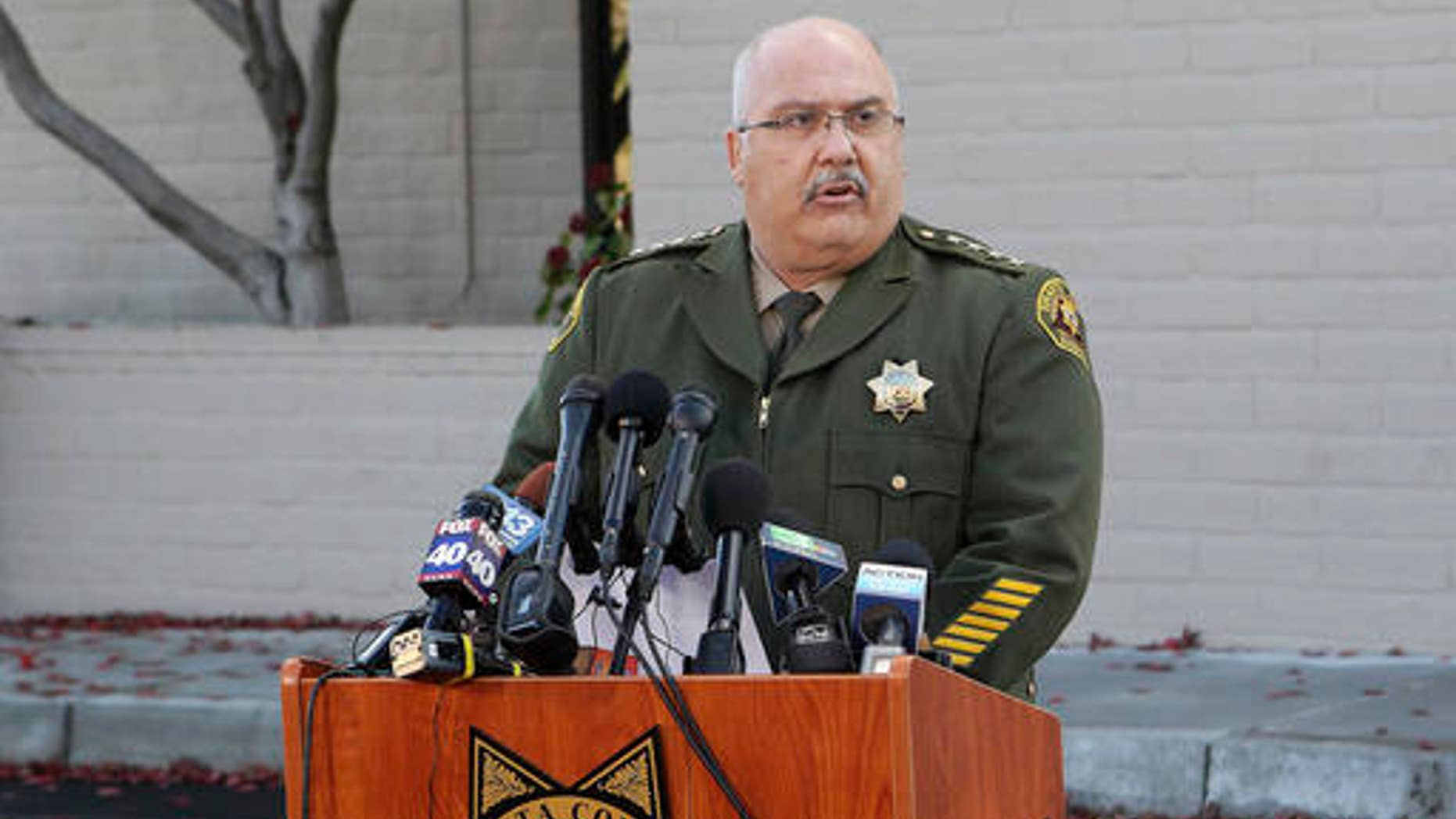 FILE - In this Nov. 30, 2016 file photo, Shasta County Sheriff Tom Bosenko speaks at a news conference to discuss the Sherri Papini case in Redding, Calif. Three weeks after Papini disappeared, the question of whether she was dead or alive was answered when the young mother and wife was spotted waving frantically for help along a California freeway early on Thanksgiving morning. But the mystery over what happened to her during those 22 days just seemed to grow deeper (Andreas Fuhrmann/The Record Searchlight via AP, File)