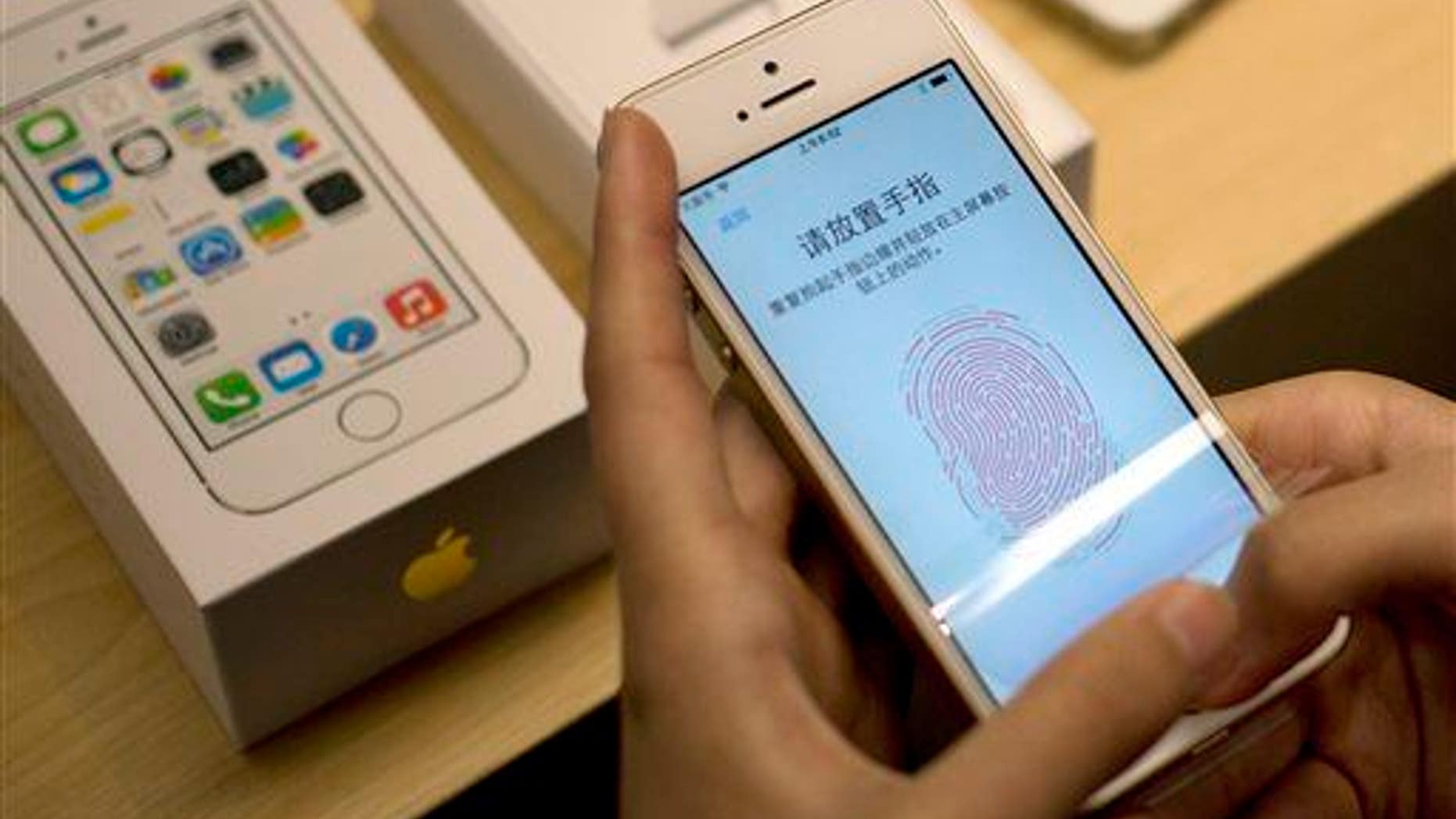 Apple's fingerprint technology on display at a store in Beijing.