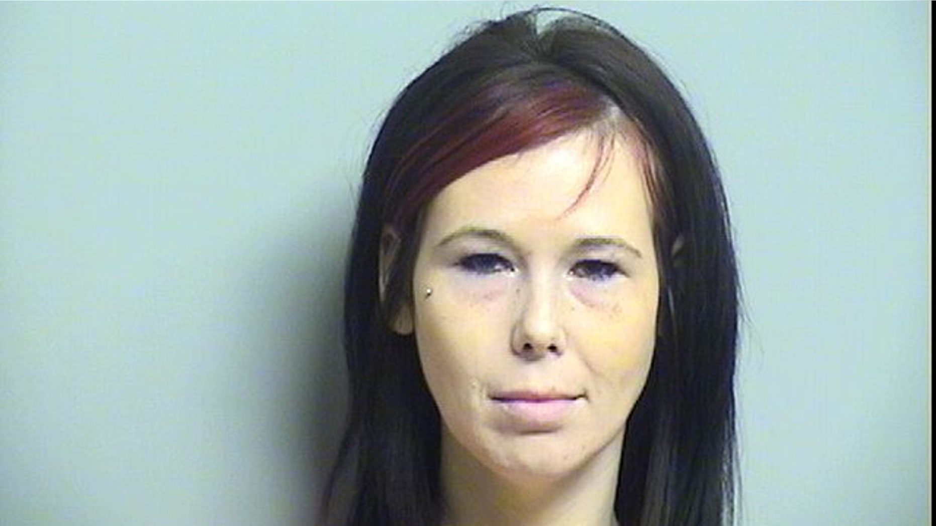 This photo shows Shynna Sims, who is accused of slashing the face of her boyfriend's deceased former girlfriend in Tulsa, Okla. (Tulsa County Jail)