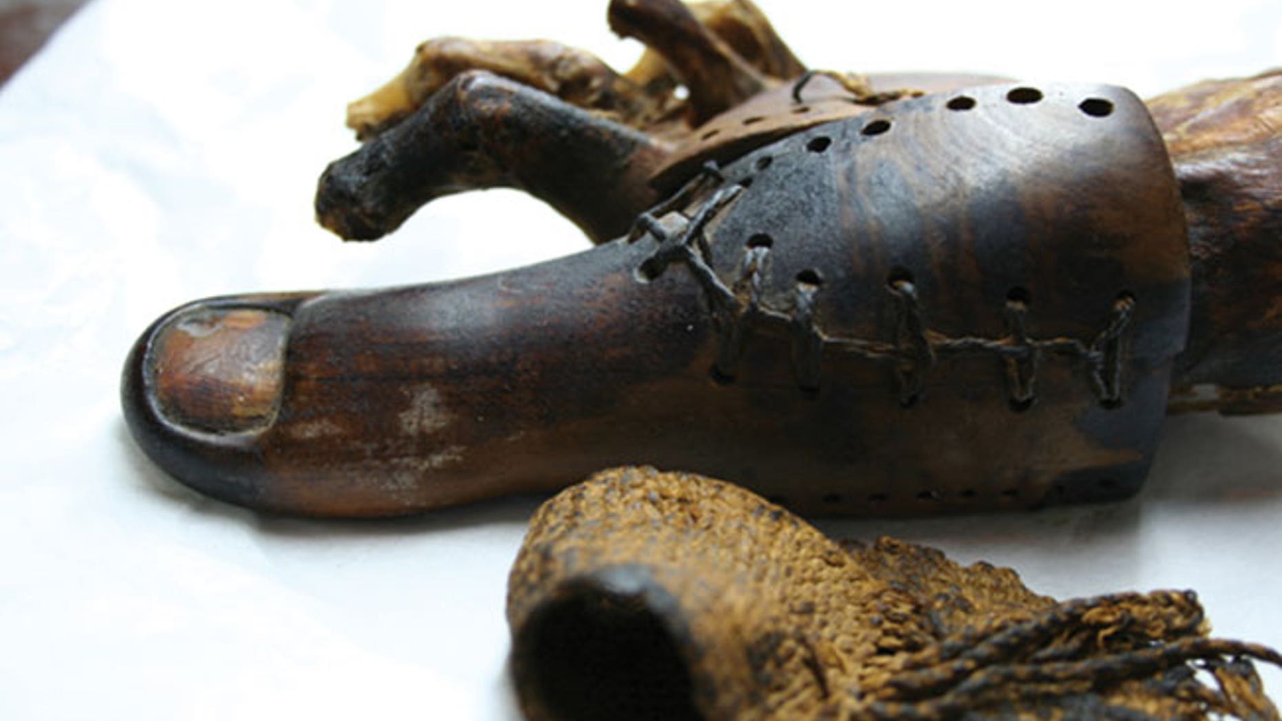 An ancient Egyptian false toe found on a female mummy buried near Luxor The strapping in the foreground bound it onto her foot.