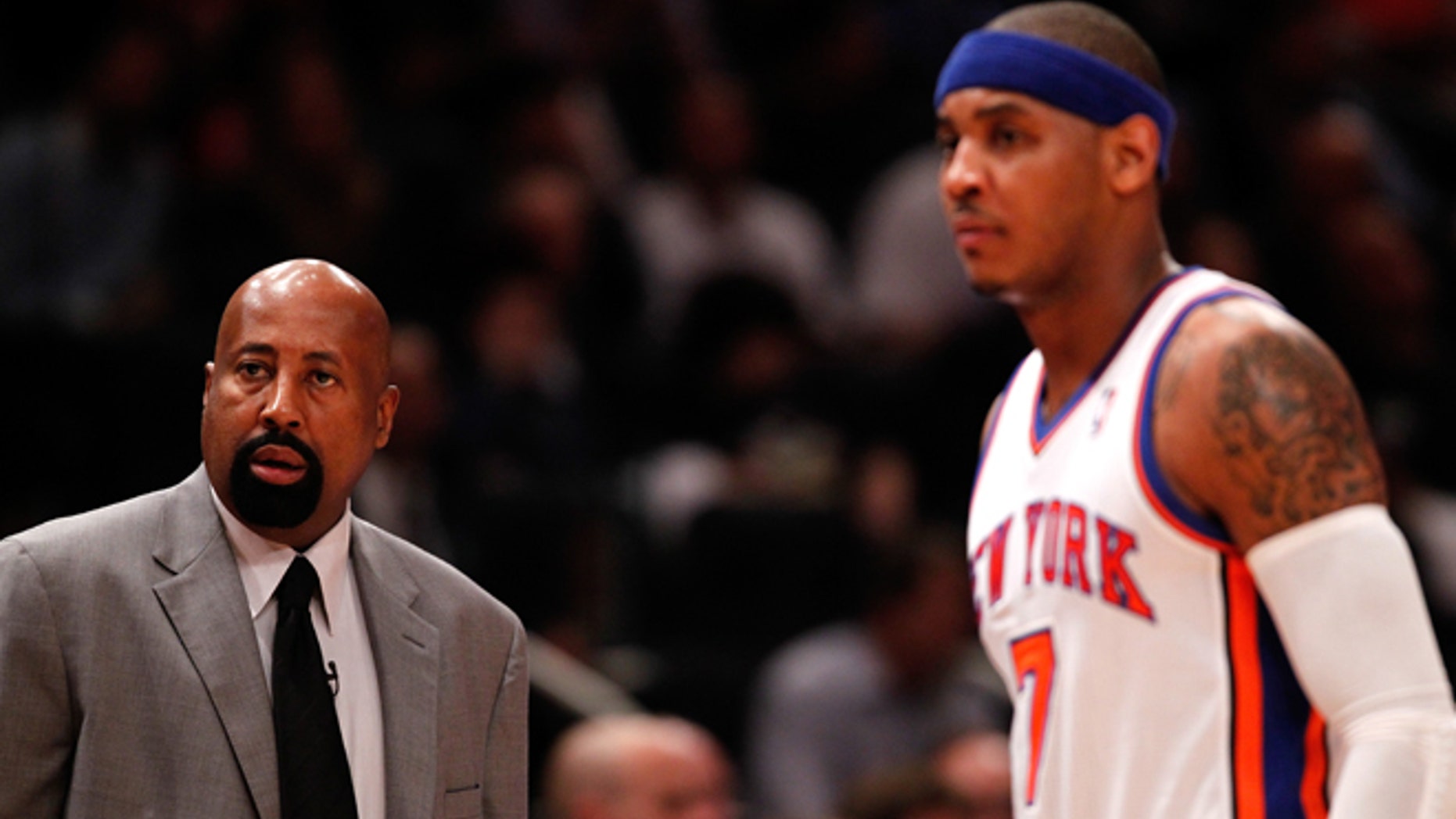 NEW YORK, NY - MAY 03: (L-R) Head coach Mike Woodson and Carmelo Anthony #7 of the New York Knicks look on against the Miami Heat in Game Three of the Eastern Conference Quarterfinals in the 2012 NBA Playoffs on May 3, 2012 at Madison Square Garden in New York City. NOTE TO USER: User expressly acknowledges and agrees that, by downloading and or using this photograph, User is consenting to the terms and conditions of the Getty Images License Agreement. (Photo by Jeff Zelevansky/Getty Images) *** Local Caption *** Mike Woodson; Carmelo Anthony