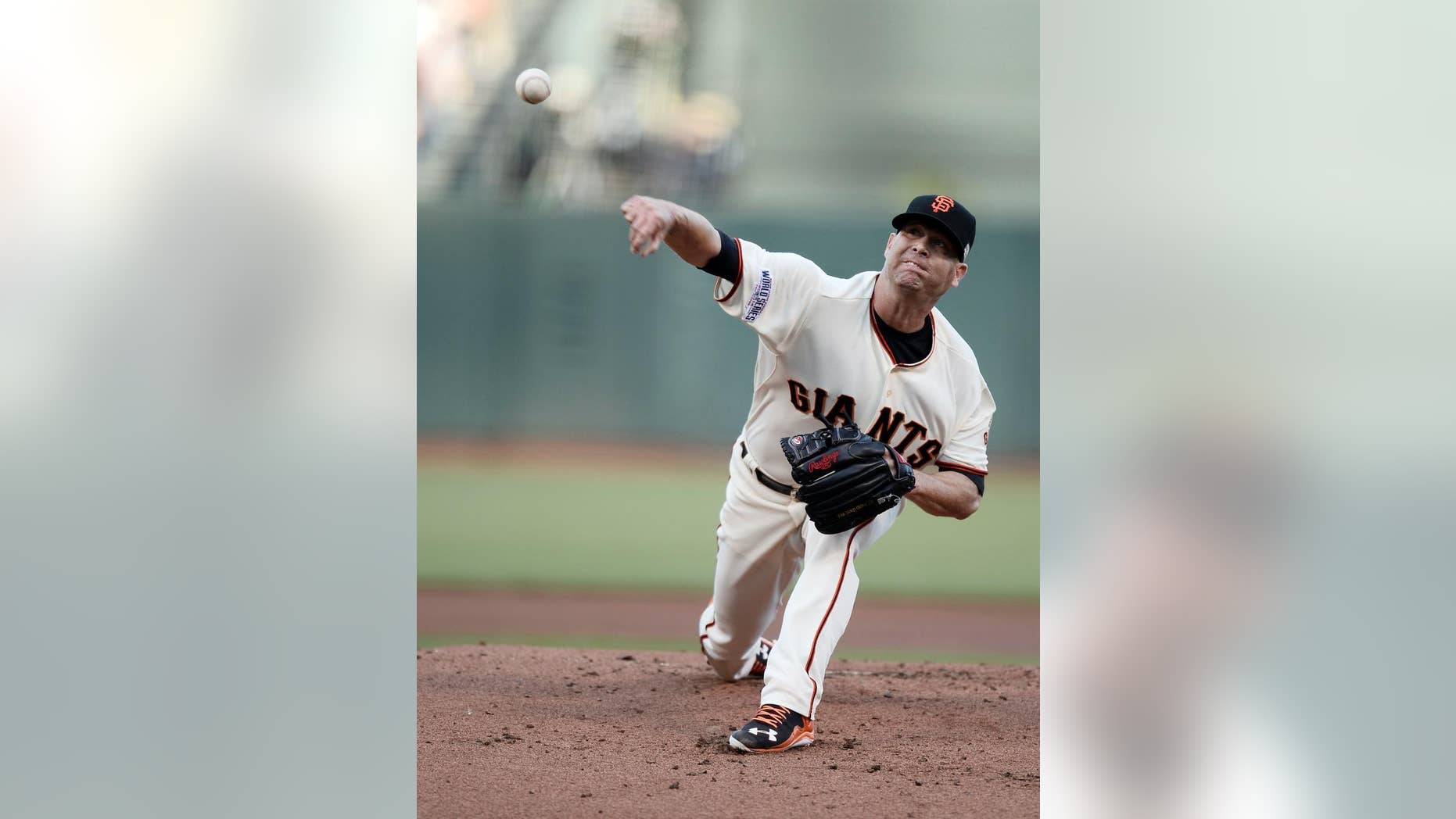 San Francisco Giants pitcher Tim Hudson throws during the first inning of Game 3 of baseball's World Series against the Kansas City Royals Friday, Oct. 24, 2014, in San Francisco. (AP Photo/Paul Buck, Pool)