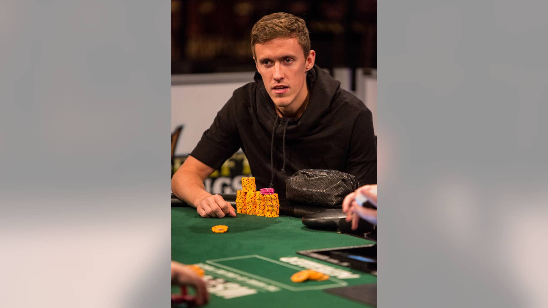 This June 18, 2014 photo provided by the World Series of Poker shows pro soccer player Max Kruse playing in the World Series of Poker at the Rio Casino in Las Vegas. Kruse, a German who was left off his country's World Cup team, placed third in his event and won $36,494 in prize money. (AP Photo/World Series of Poker, Melissa Haereiti)