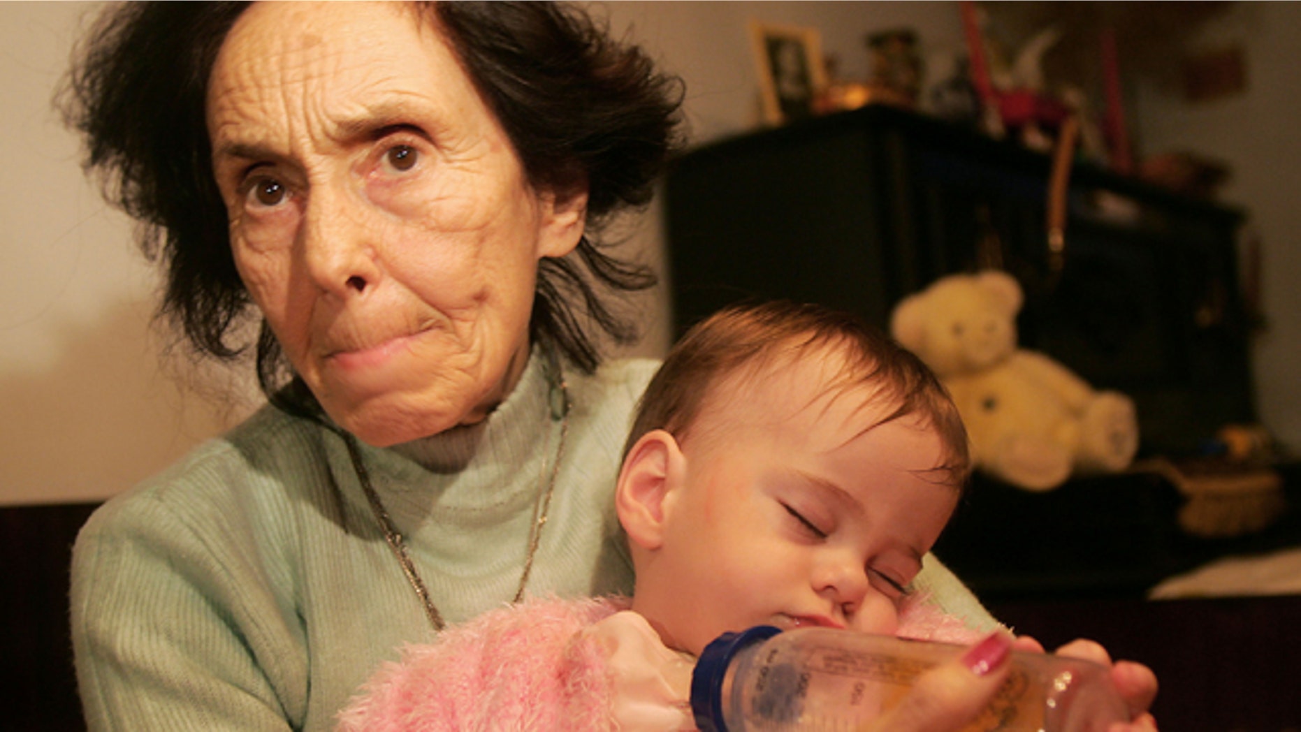 Adriana Iliescu, 67, holds her one-year-old daughter Eliza-Maria in her apartment in Bucharest, Romania January 16, 2006. Doctors said that one year ago, the 66-year-old Romanian woman was the world's oldest recorded woman to give birth. Iliescu, an university professor and author of children's books, gave birth after doctors used in vitro fertilization and the sperm and eggs from younger people, an act slammed by the Romanian Orthodox Church as 'selfish' and which stirred debate in the local press.
