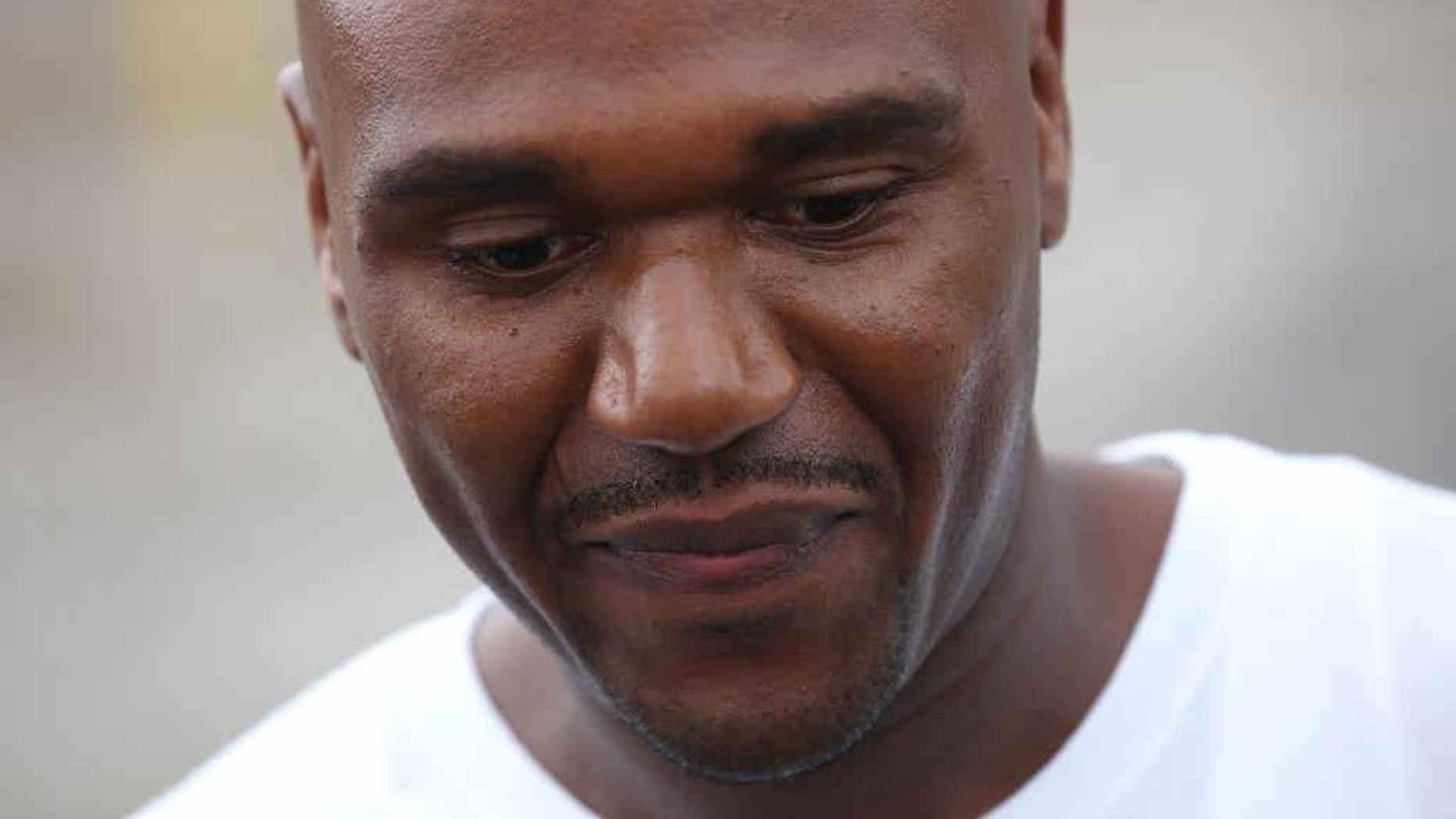 In this Aug. 31, 2012 photo, Alprentiss Nash, who was been behind bars since his murder conviction in 1995, walks free from the Menard Correctional Center in downstate Chester, Ill., after Cook County prosecutors dropped the case against him. Chicago Police said Wednesday, July 29, 2015, that Nash was fatally shot in Chicago, Tuesday, July 28 after after an argument during "some sort of transaction" between Nash and his attacker. (E. Jason Wambsgans/Chicago Tribune via AP)
