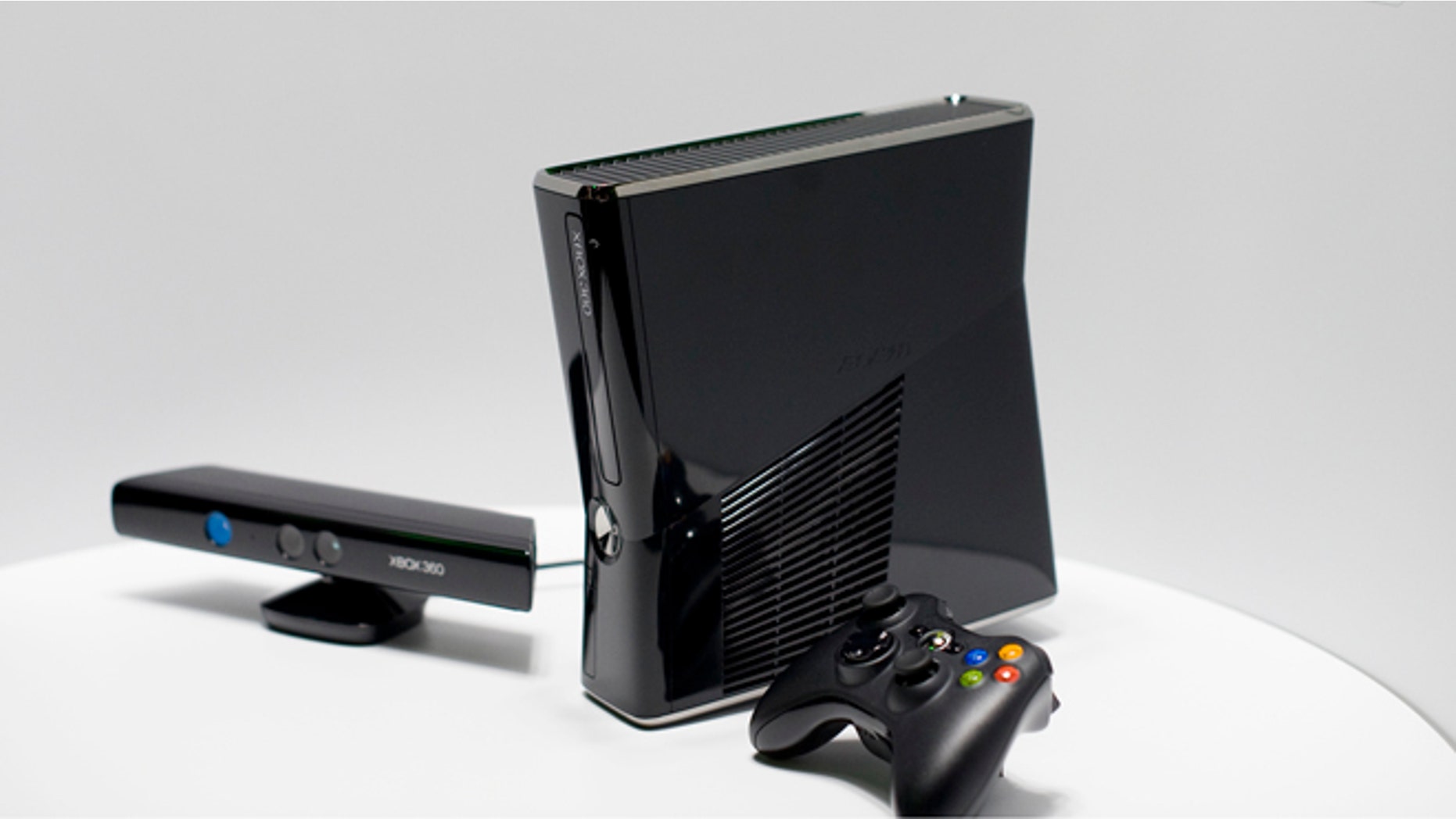 The new XBox 360 console and Kinect peripheral (L) is on display as it's revealed at Microsoft's press briefing ahead of the Electronic Entertainment Expo (E3) at the Wiltern Theater June 14, 2010 in Los Angeles, California. (Photo by Michal Czerwonka/Getty Images)