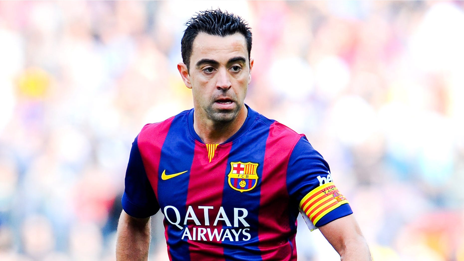 BARCELONA, SPAIN - APRIL 18: Xavi Hernandez of FC Barcelona runs with the ball during the La Liga match between FC Barcelona and Valencia CF at Camp Nou on April 18, 2015 in Barcelona, Spain. (Photo by David Ramos/Getty Images)