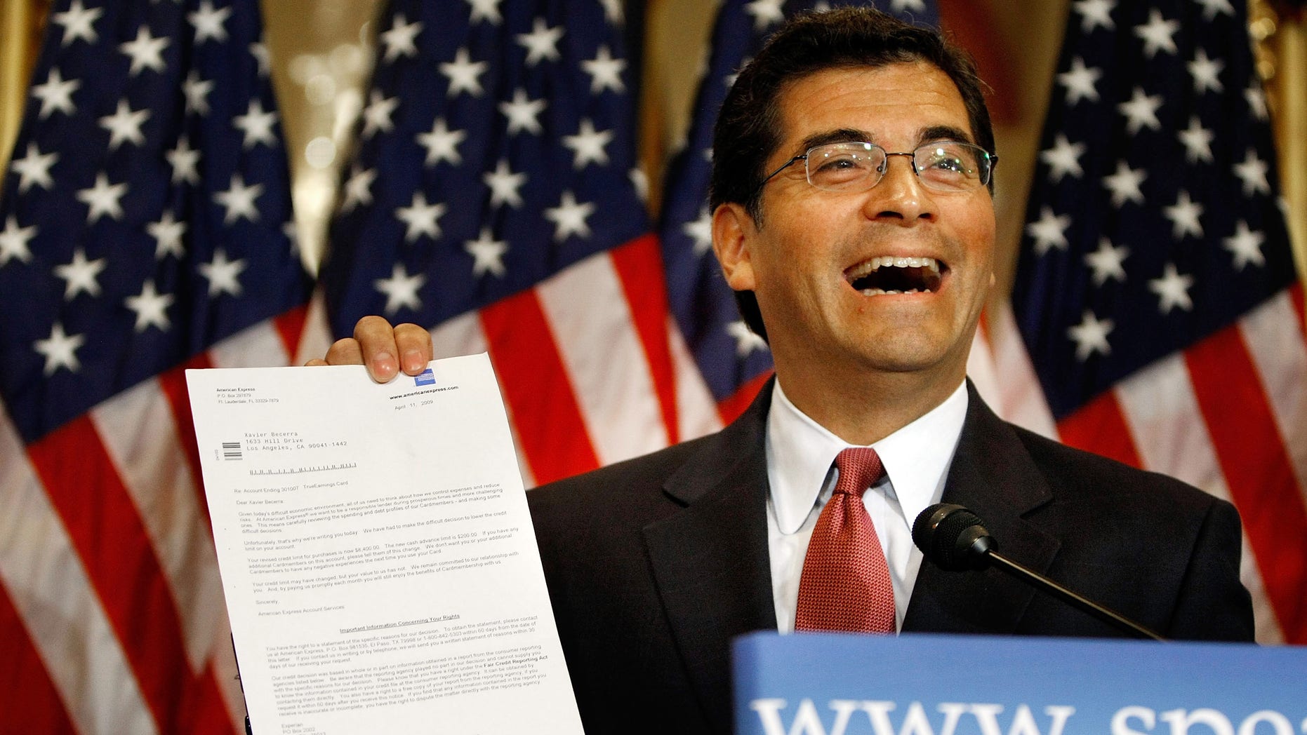 WASHINGTON - MAY 22: House Democratic Caucus Vice Chair Rep. Xavier Becerra (D-CA) holds up a letter he received from his credit card company informing hime that his interest rate will increace during the Speaker of the House's weekly news conference at the U.S. Captiol May 22, 2009 in Washington, DC. Speaker of the Hosue Nancy Pelosi (D-CA) turned the news conference into an opportunity to list what she and the Democratic House leadership considered their successes of the 111th Congress' first session. She took a handful of questions about her upcomming trip to China and her statements about the CIA. (Photo by Chip Somodevilla/Getty Images)