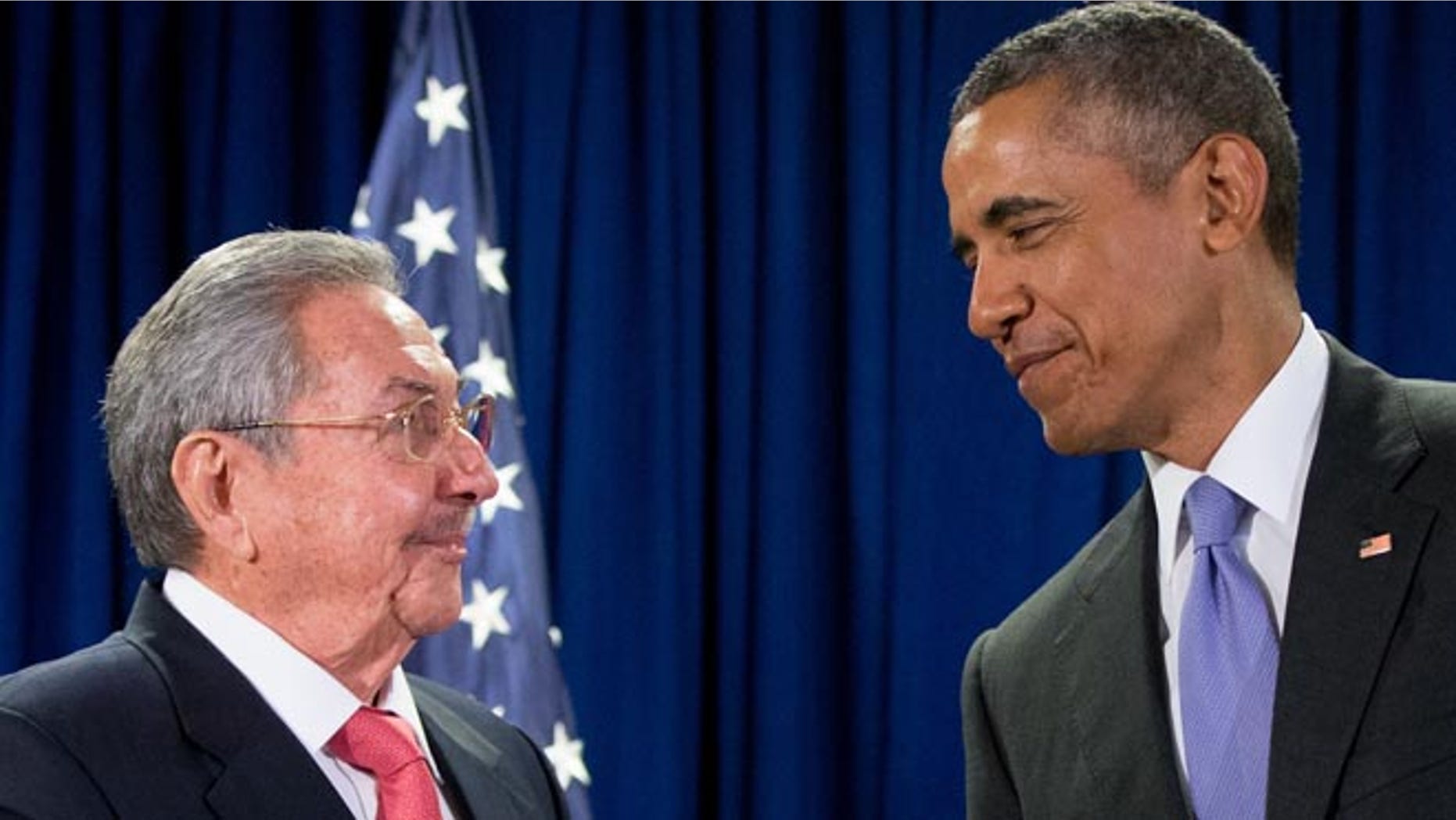 FILE - In this Tuesday, Sept. 29, 2015 file photo, U.S. President Barack Obama stands with Cuba's President Raul Castro before a bilateral meeting at the United Nations headquarters. (AP Photo/Andrew Harnik)